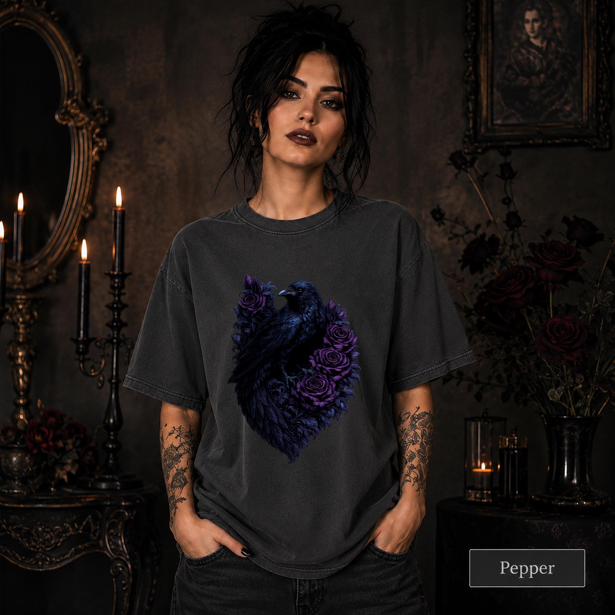 Pepper graphic tee with a detailed raven surrounded by purple floral artwork.