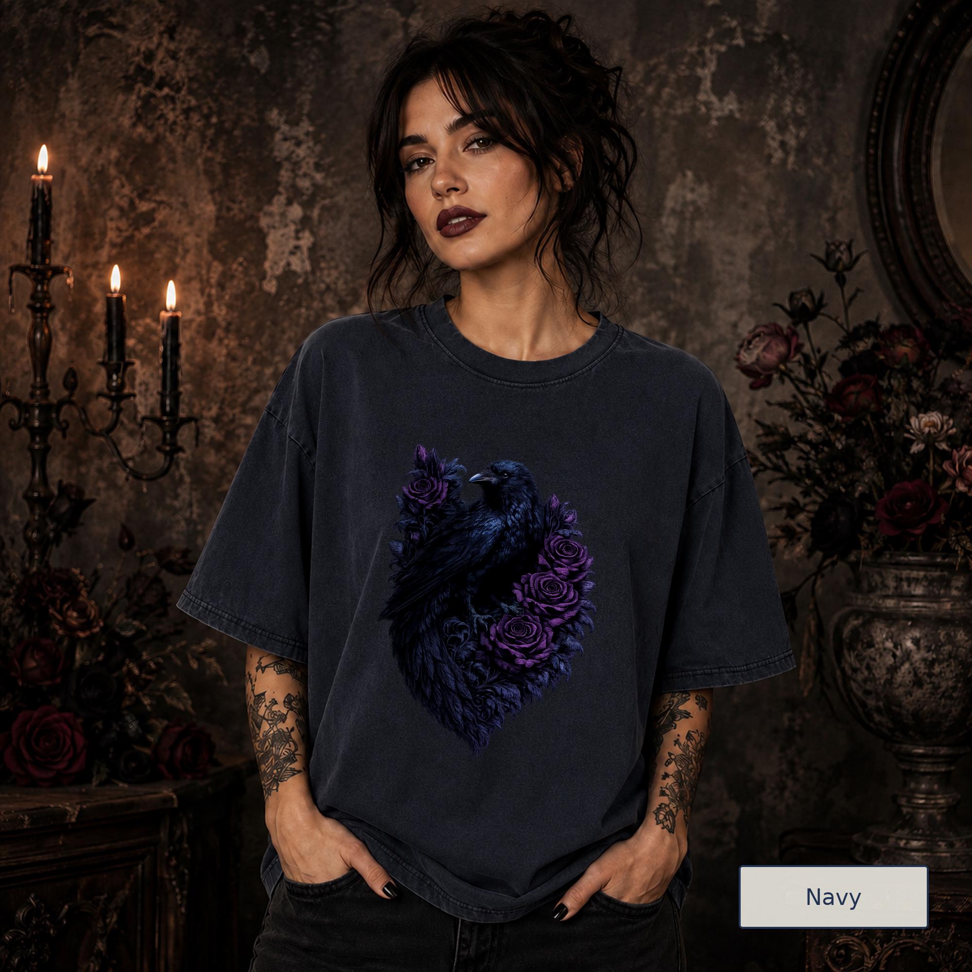 Raven and rose tee styled in a shadowy room with black candles and burgundy florals.