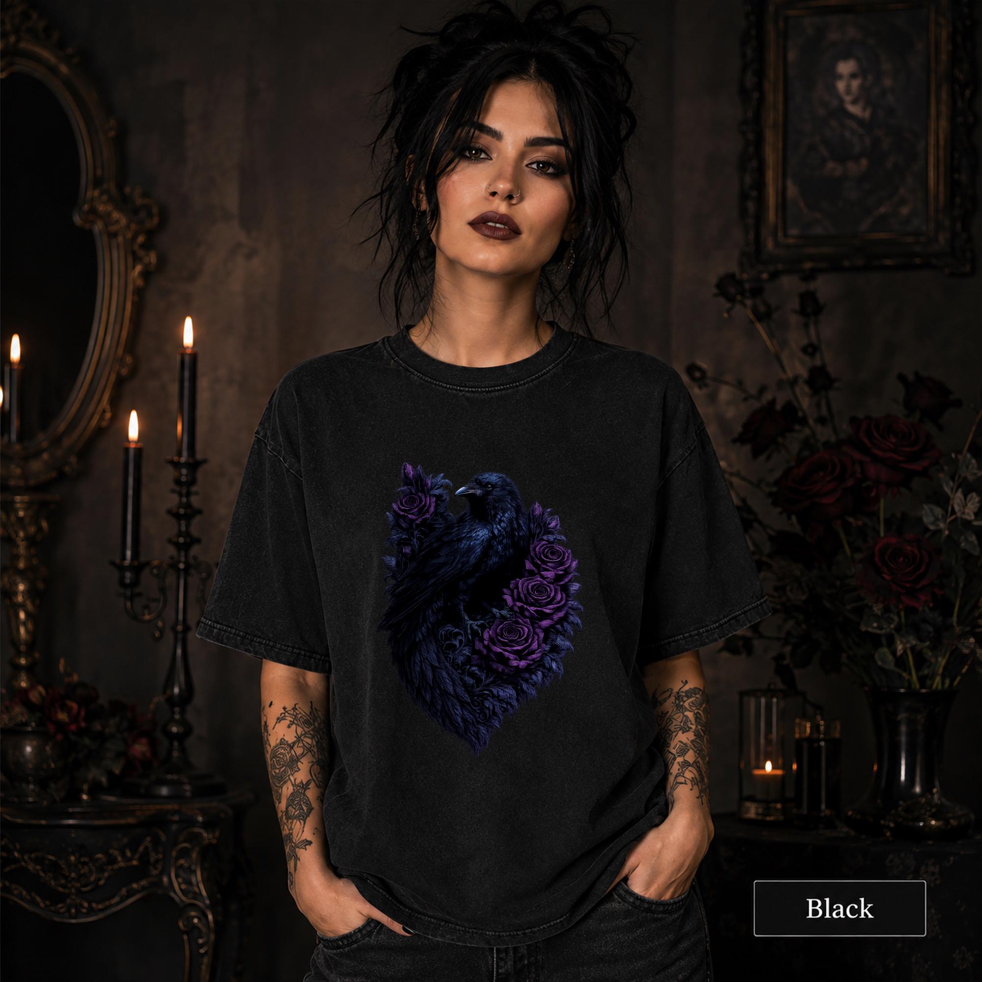 Woman wearing a black gothic raven T-shirt featuring deep purple roses in a dark candlelit room.