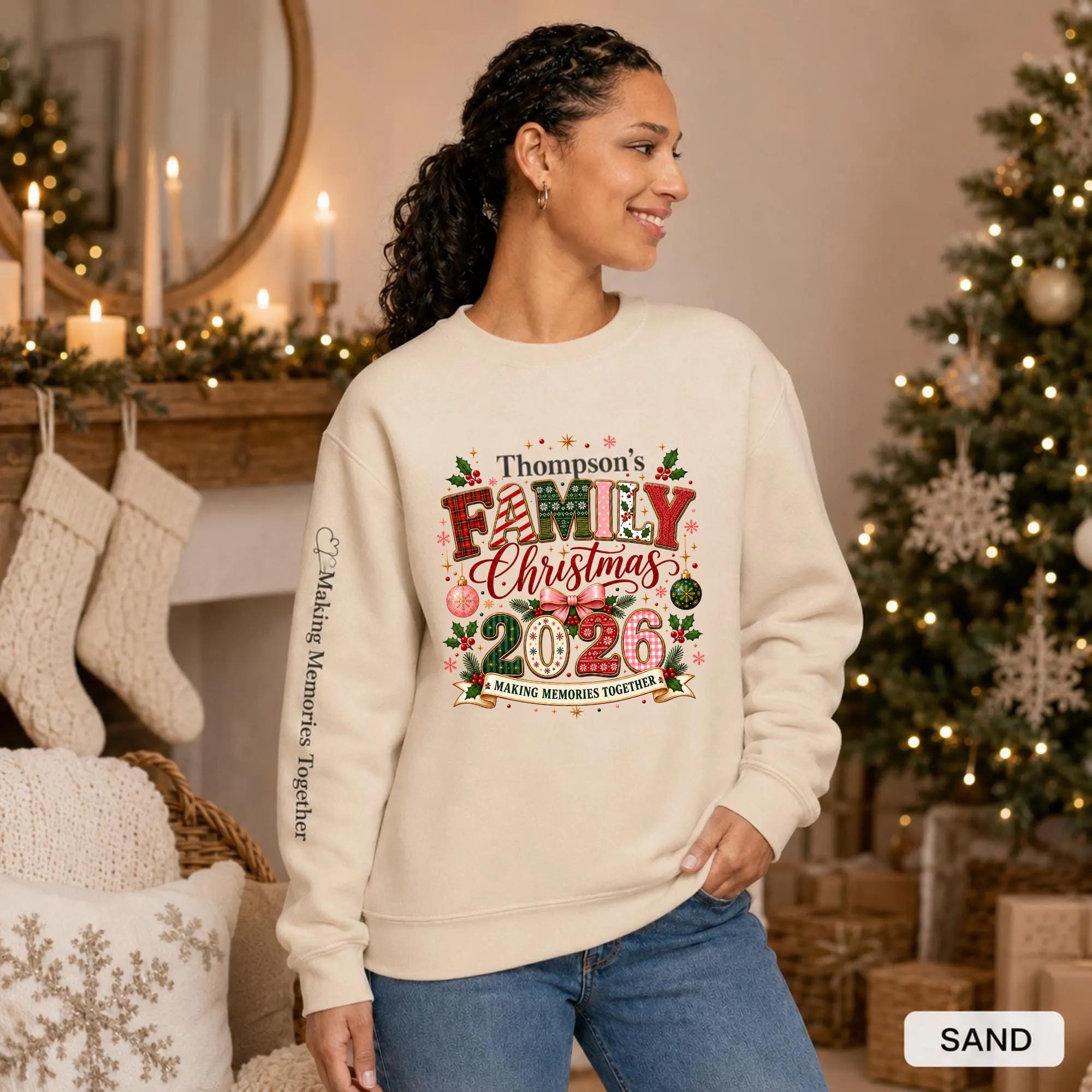 Sand Christmas crewneck featuring a personalized Thompson’s Family Christmas 2026 design with festive lettering and sleeve text.