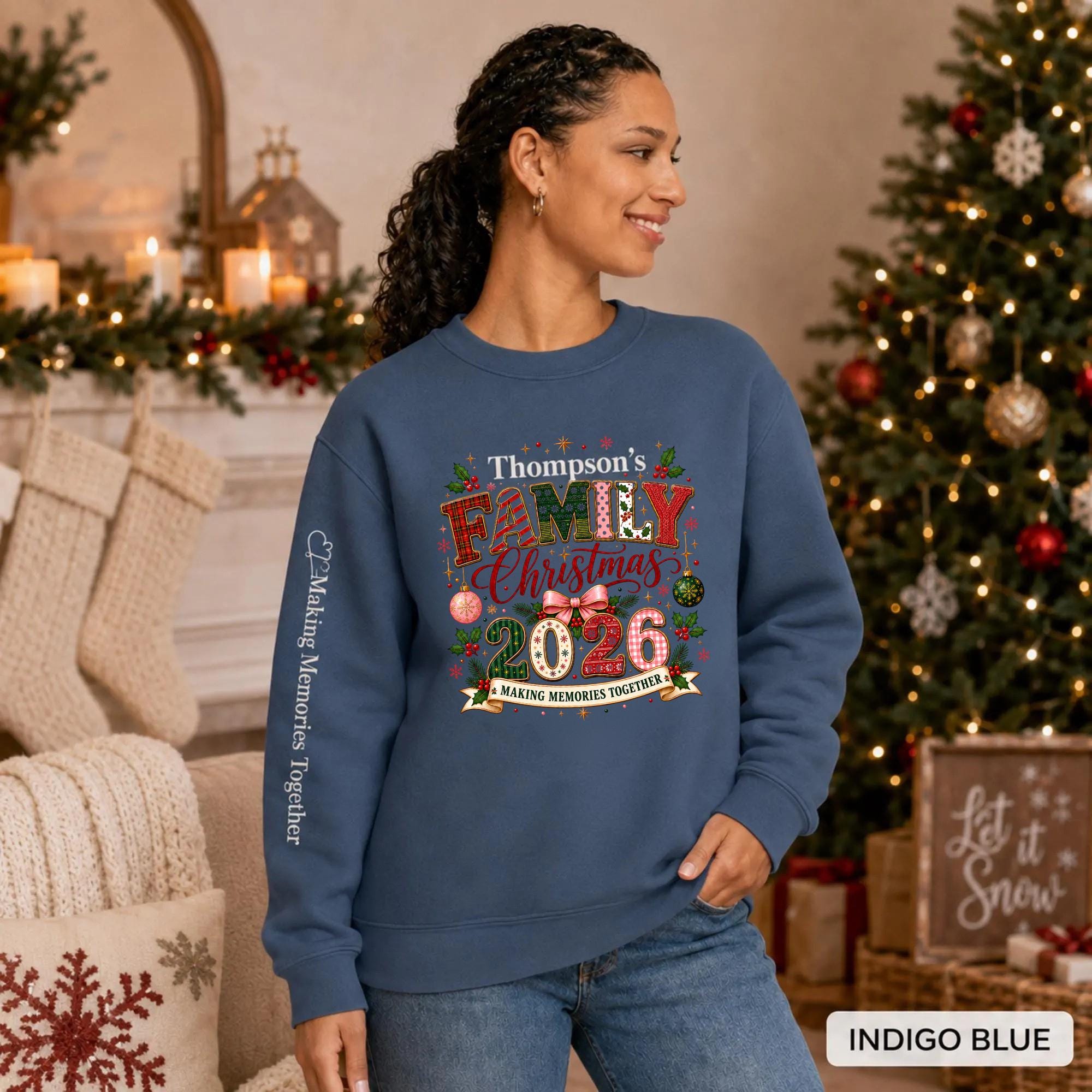 Indigo blue Christmas crewneck featuring a personalized Thompson’s Family Christmas 2026 design with festive lettering and sleeve text.