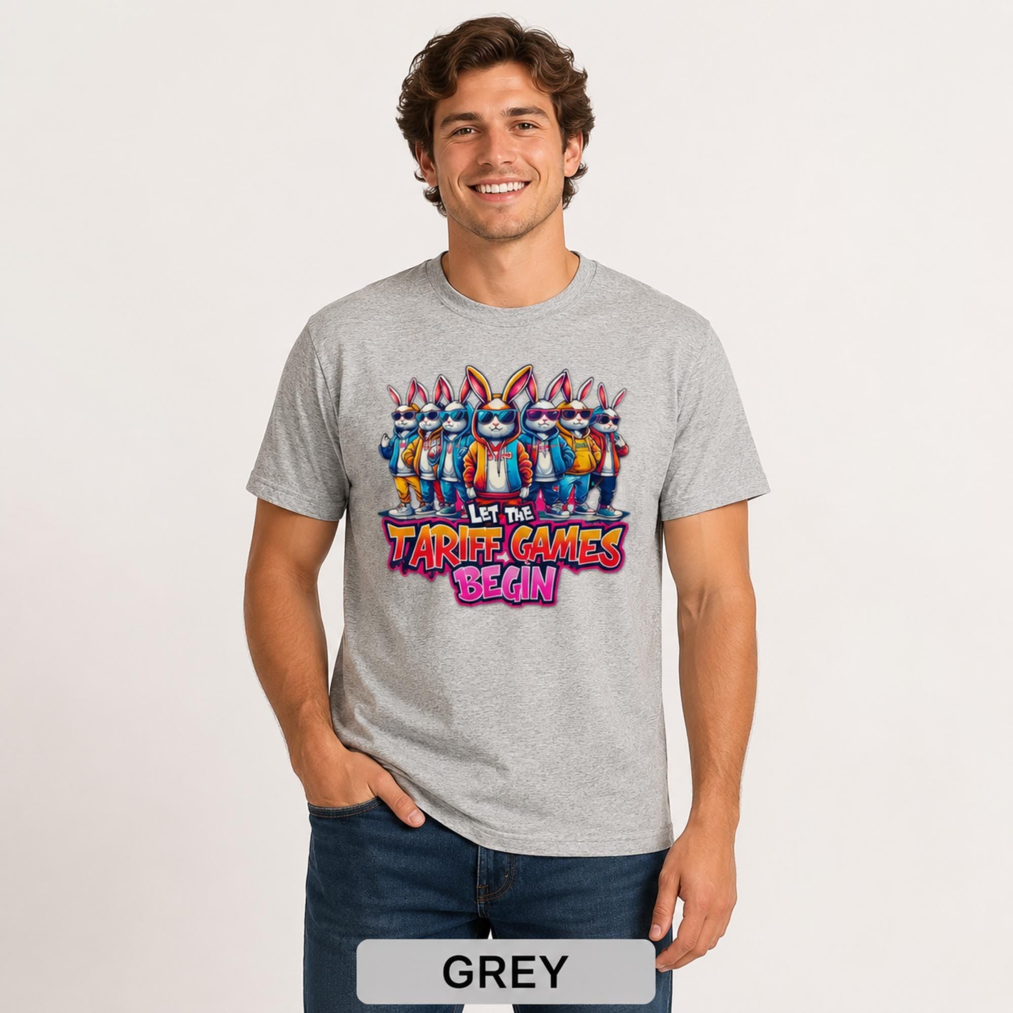 Male model wearing a grey T-shirt featuring stylish cartoon rabbits and bold “Let the Tariff Games Begin” text.