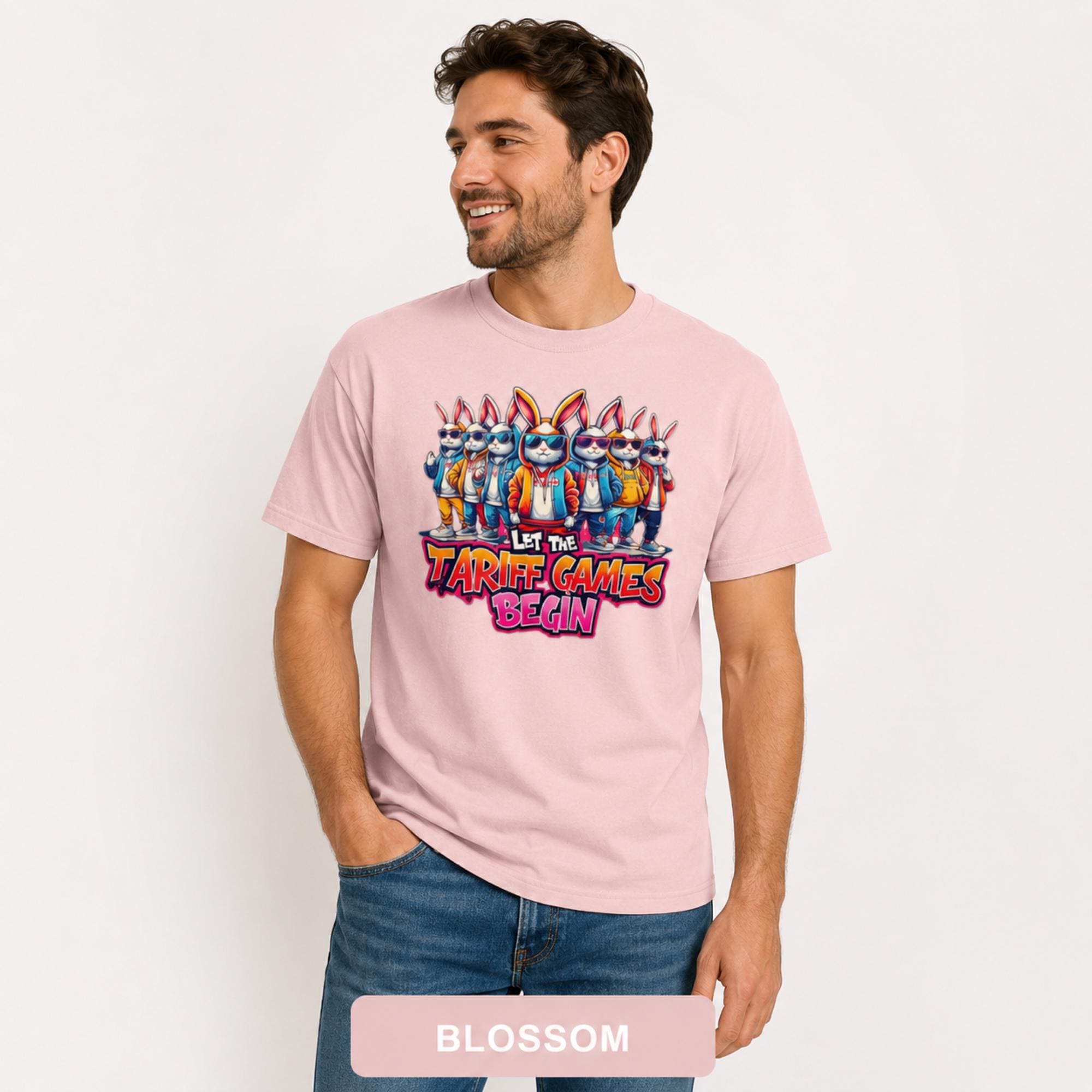 Male model wearing a blossom T-shirt featuring stylish cartoon rabbits and bold “Let the Tariff Games Begin” text.