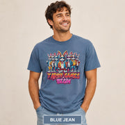 Male model wearing a blue jean T-shirt featuring stylish cartoon rabbits and bold “Let the Tariff Games Begin” text.