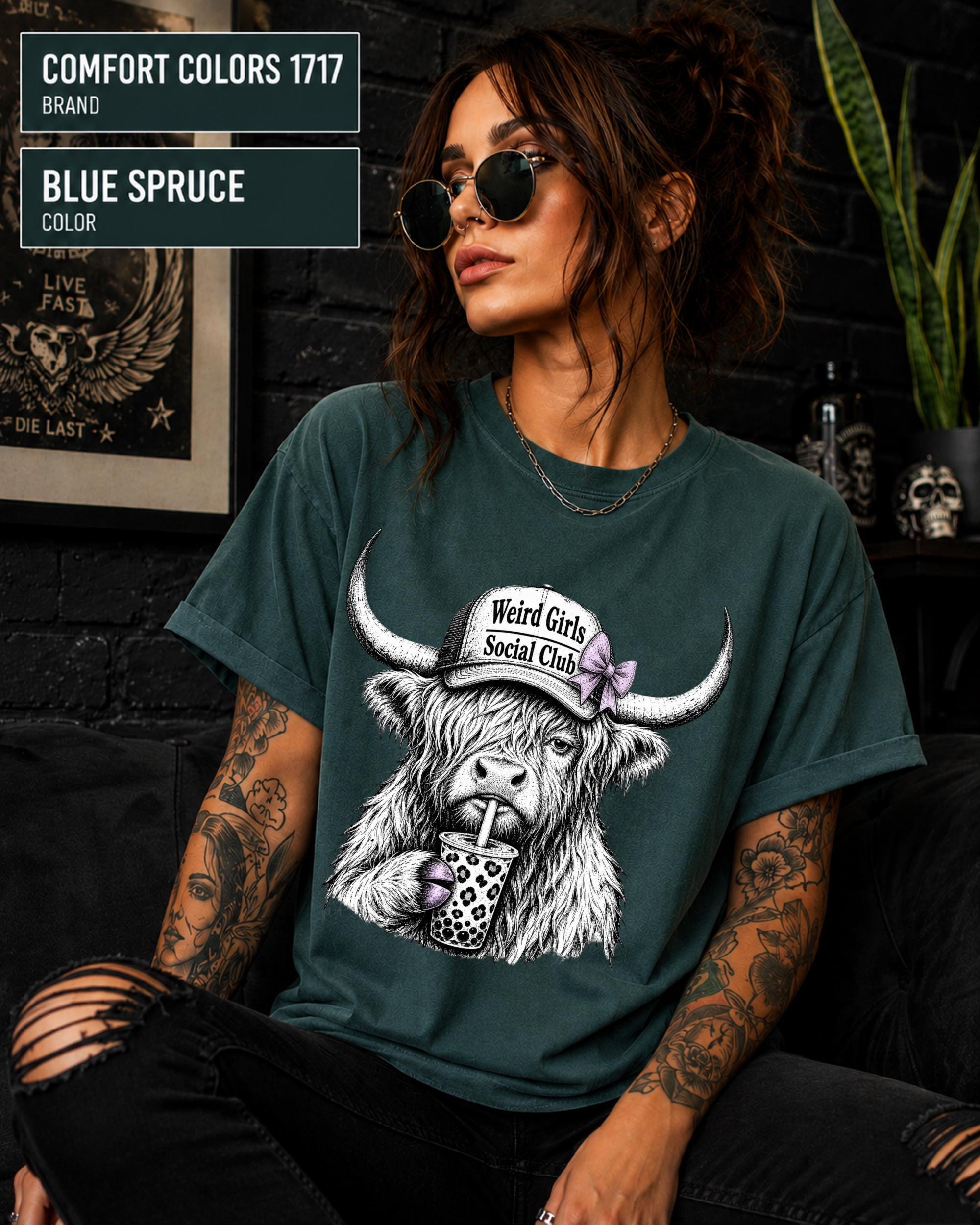 Weird Girls Social Club shirt styled with ripped black jeans, sunglasses, and layered silver necklaces.