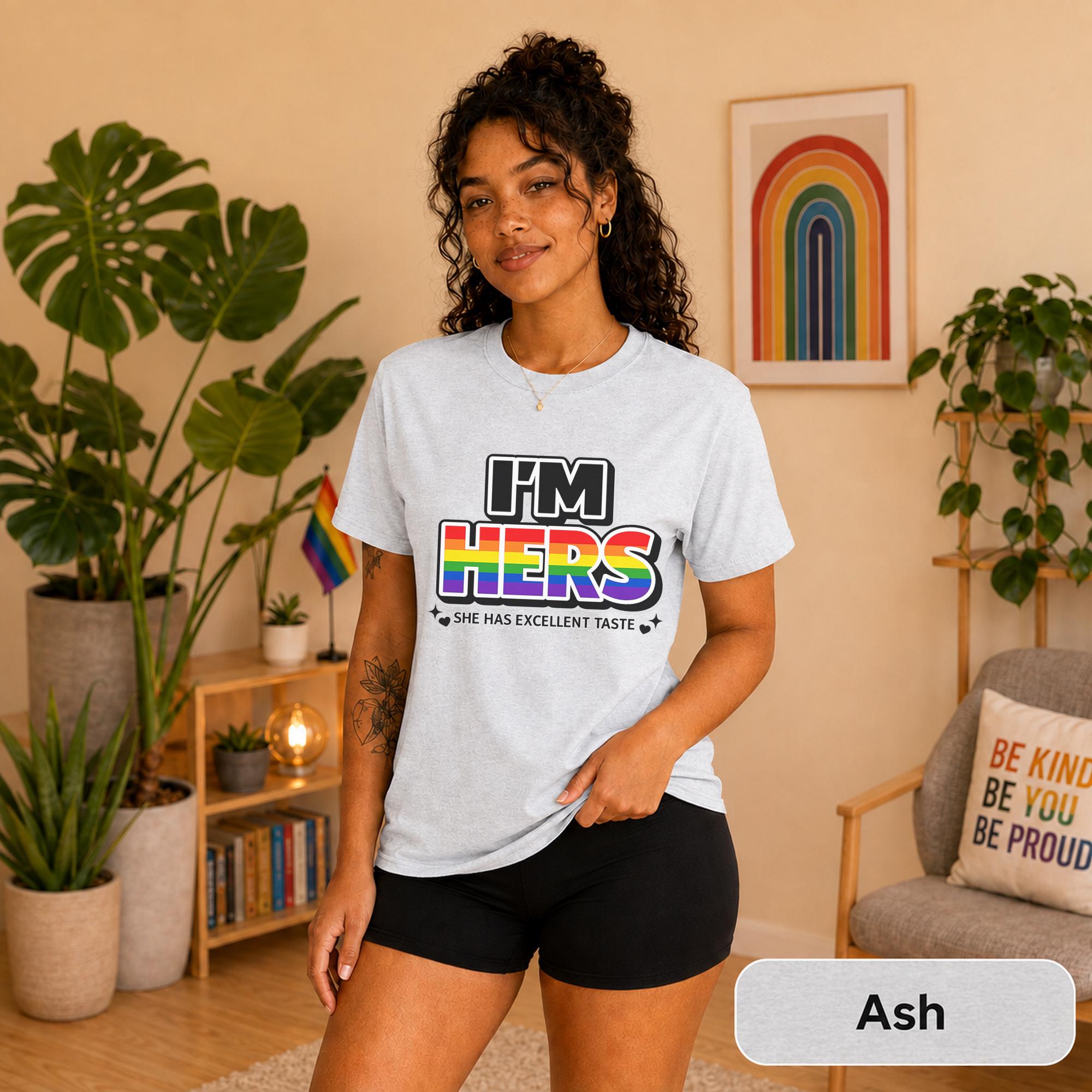 Rainbow couple shirts photographed with plants, Pride flags, and warm neutral decor.