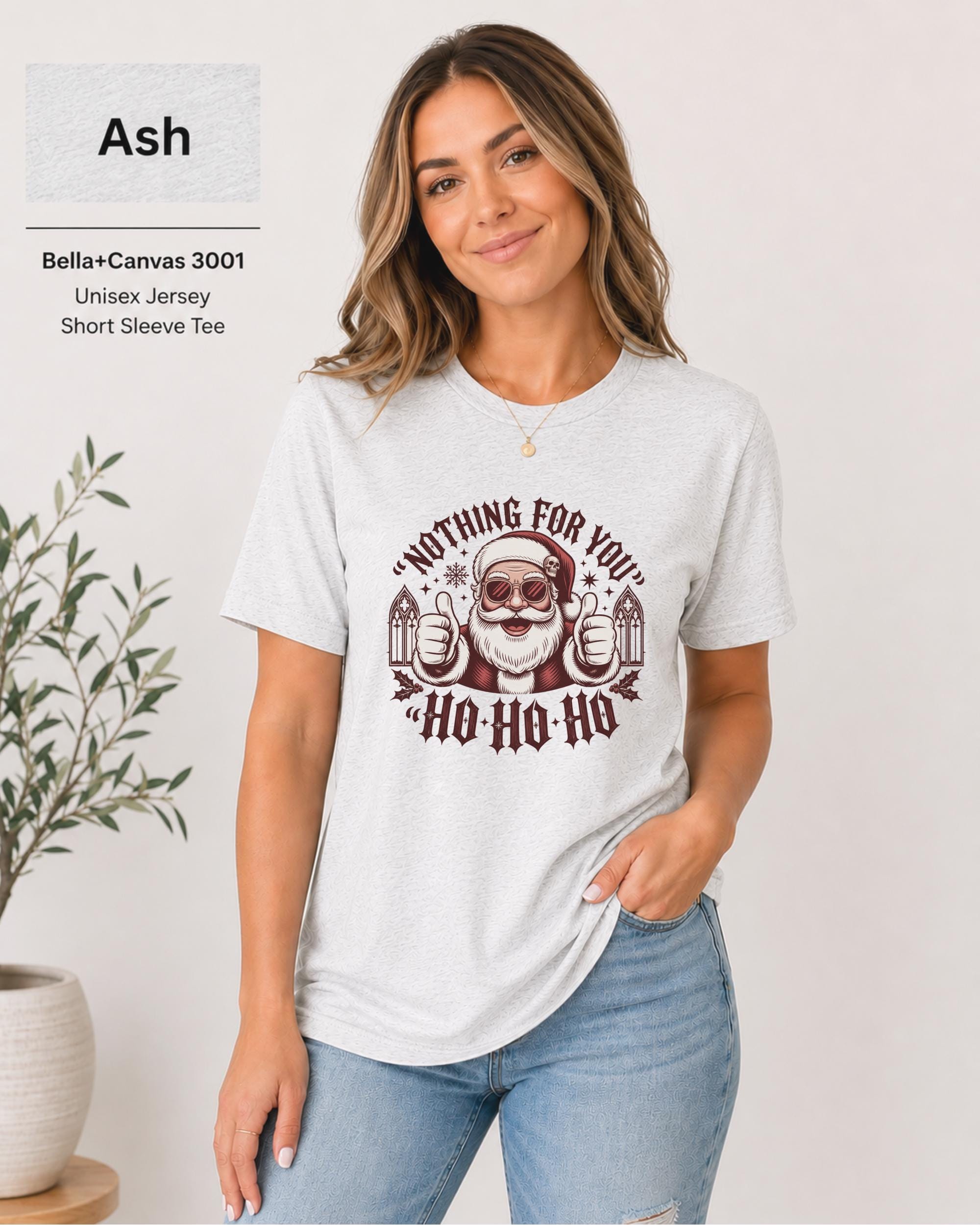 Woman wearing an Ash Bella Canvas 3001 Nothing for You Santa Christmas shirt with gothic holiday artwork.