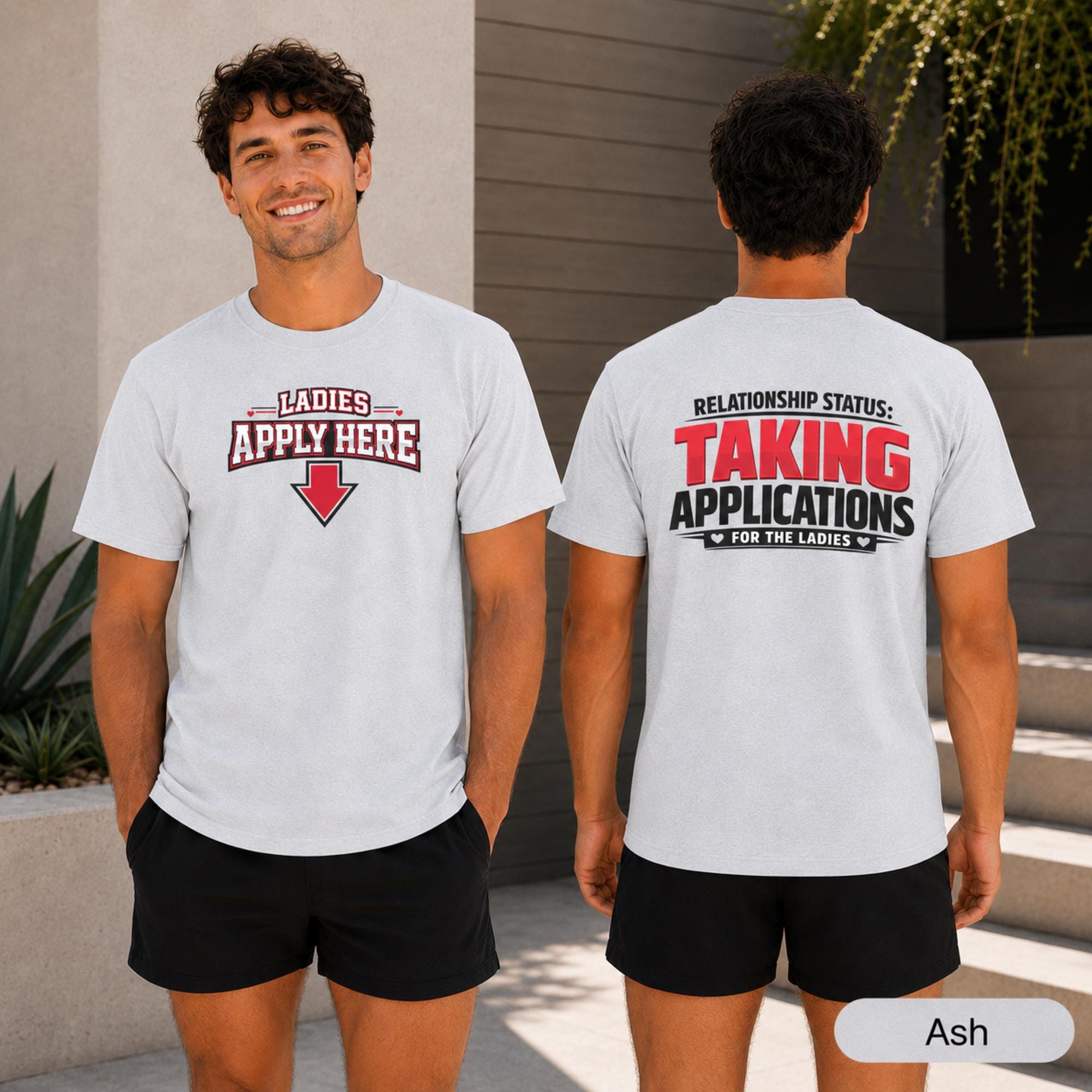 Man wearing an Ash shirt with Ladies Apply Here text and a large red downward arrow on the front.