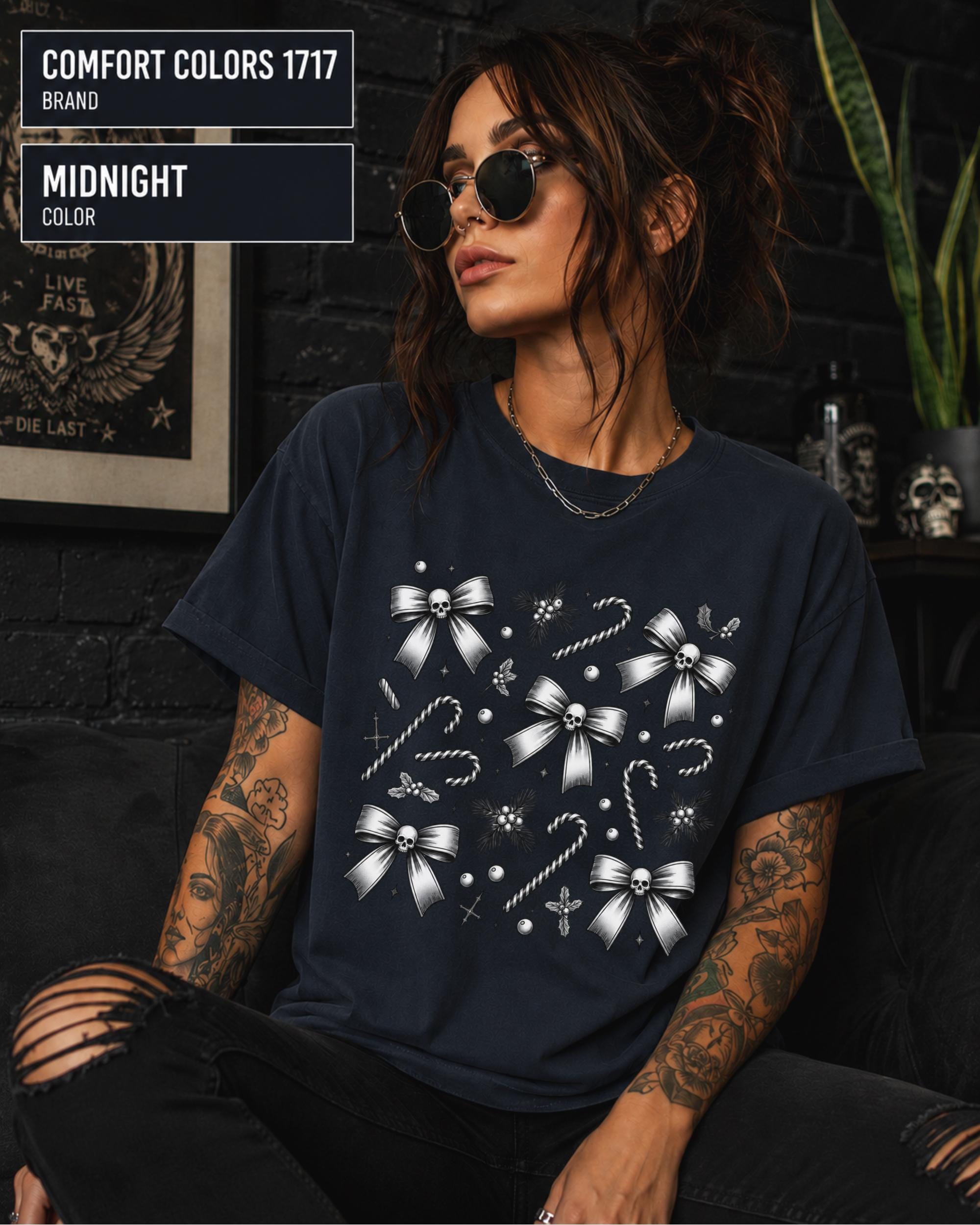 Gothic winter graphic tee with monochrome festive artwork and decorative cross accents.