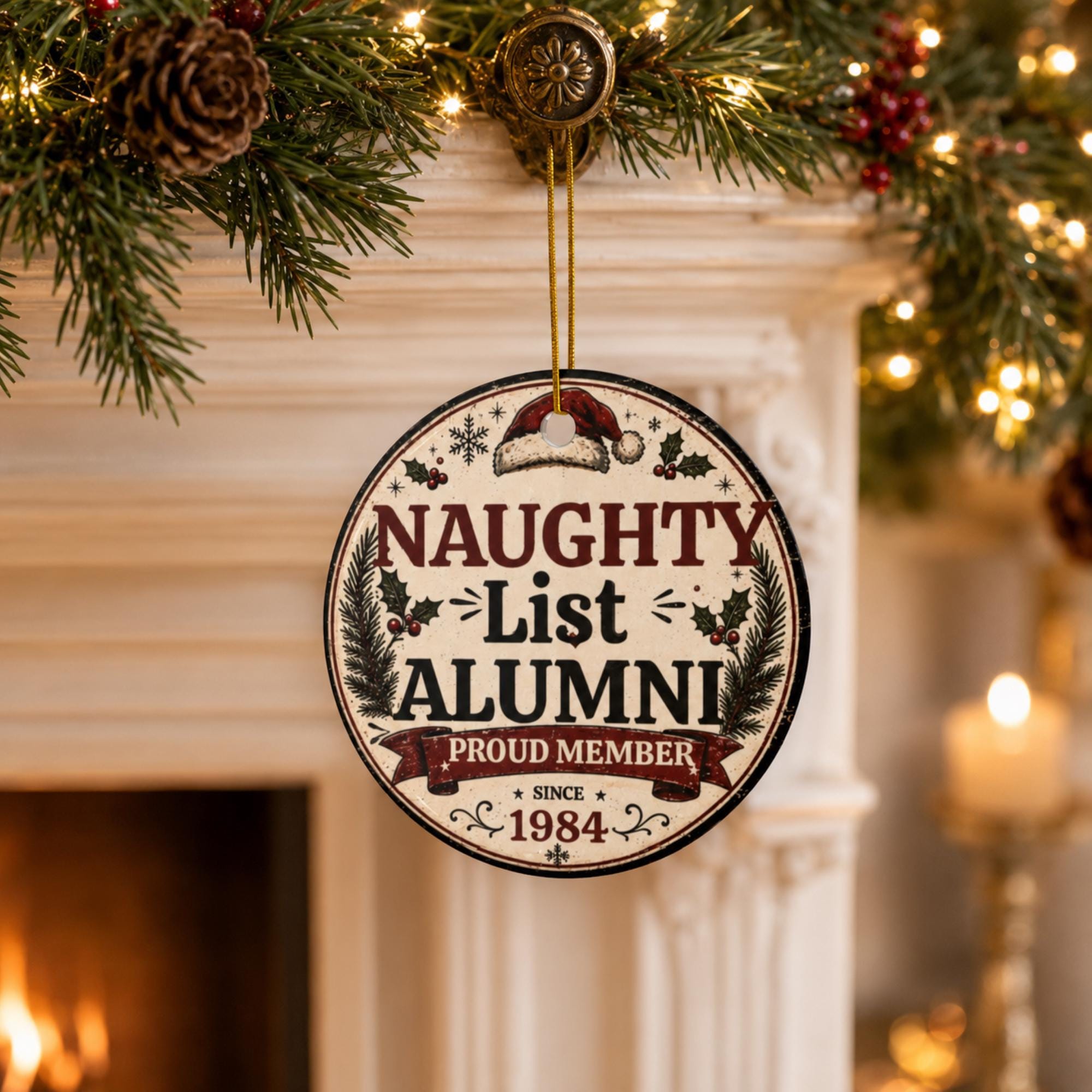 Naughty List Alumni ceramic Christmas ornament hanging on a decorated holiday tree with festive lights.
