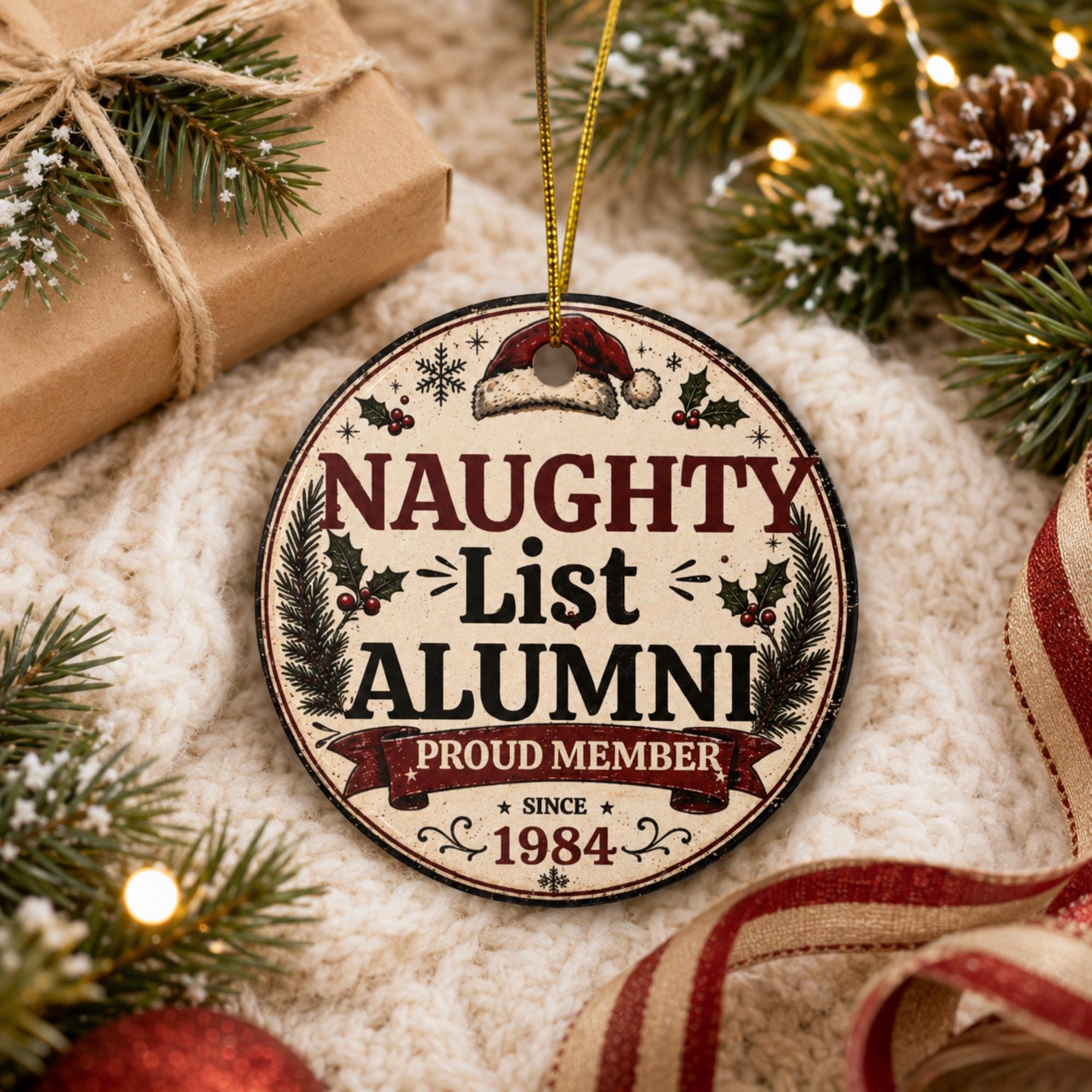 Close-up of funny Naughty List Alumni ornament featuring vintage holiday typography and glossy ceramic finish.