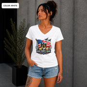 Woman wearing a white Air Force Mom V-neck shirt featuring combat boots and American flag.