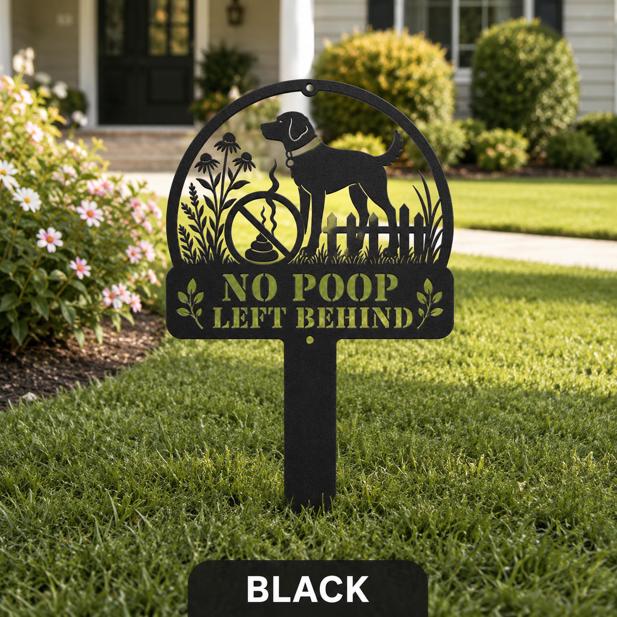 Black metal No Poop Left Behind dog yard sign displayed in a landscaped front lawn.