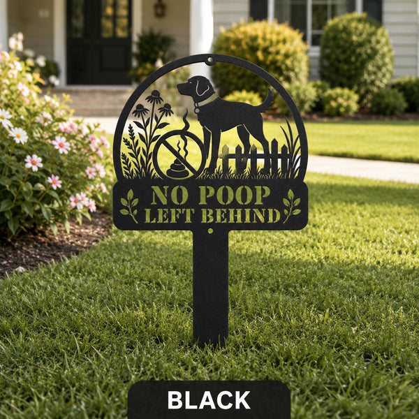 Black metal No Poop Left Behind dog yard sign displayed in a landscaped front lawn.