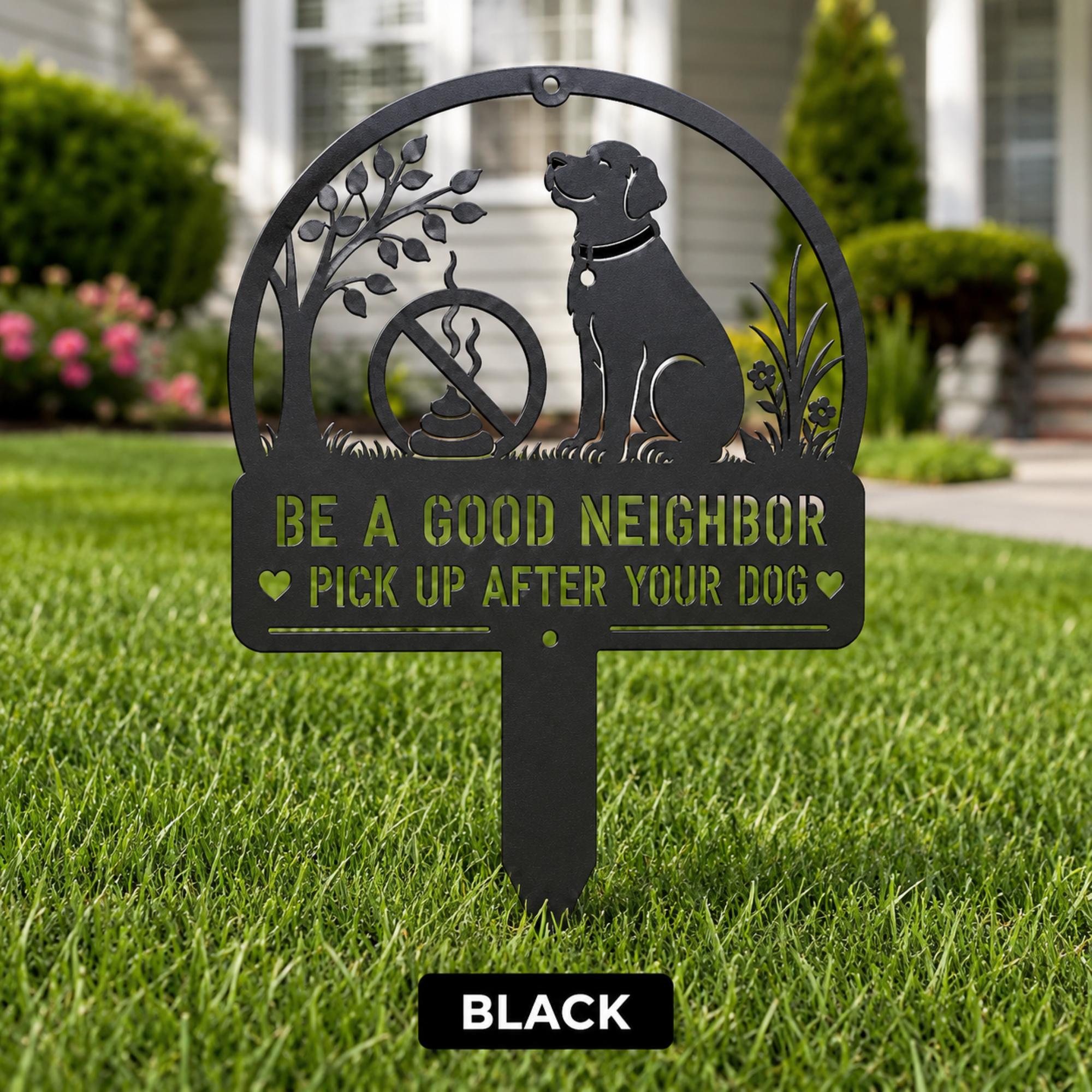 Black metal yard stake sign with dog silhouette and the text Be a Good Neighbor Pick Up After Your Dog displayed on a front lawn.