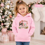 Kids Christmas pullover featuring Santa hats, candy-cane lettering, holly, bells, and stars.