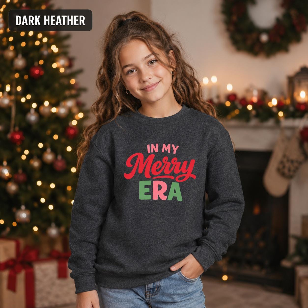 Kids holiday crewneck featuring red, pink, and green retro Christmas lettering.
