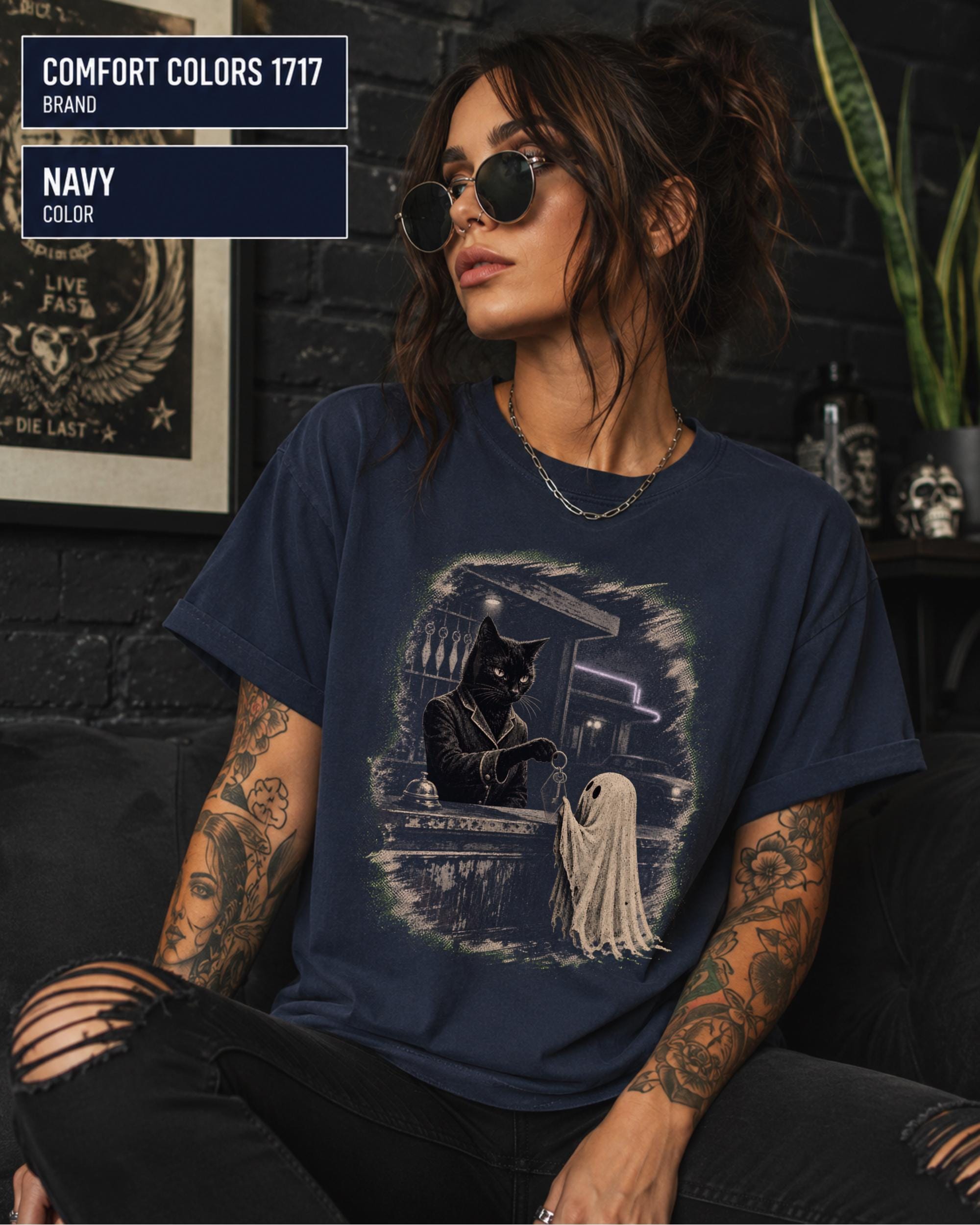 Gothic fall shirt with haunted hotel counter scene and softly distressed artwork.