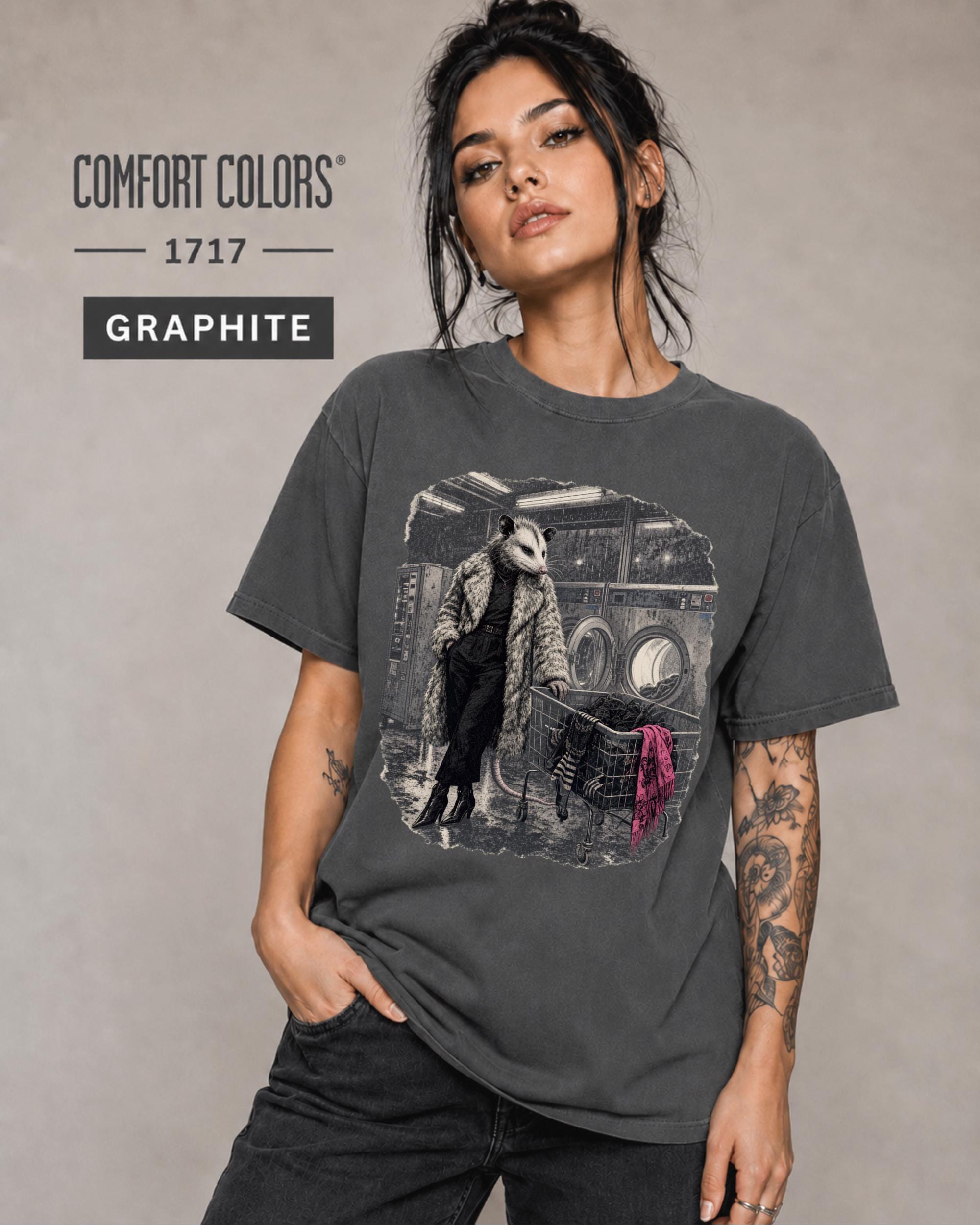 Comfort Colors Graphite tee featuring an unusual laundromat scene with a fashionable opossum.