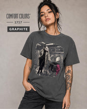 Comfort Colors Graphite tee featuring an unusual laundromat scene with a fashionable opossum.