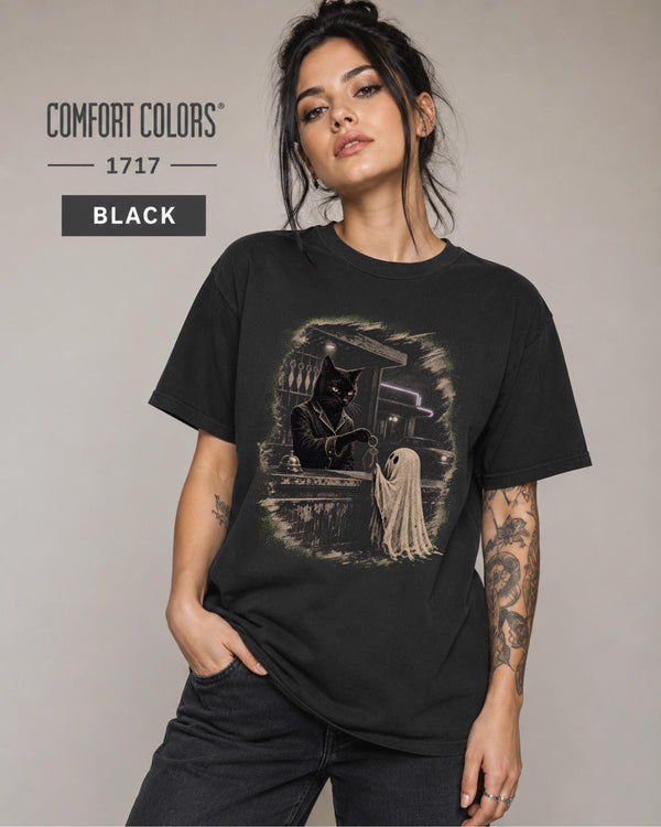 Vintage Halloween graphic tee showing a dressed black cat handing a key to a sheet ghost.