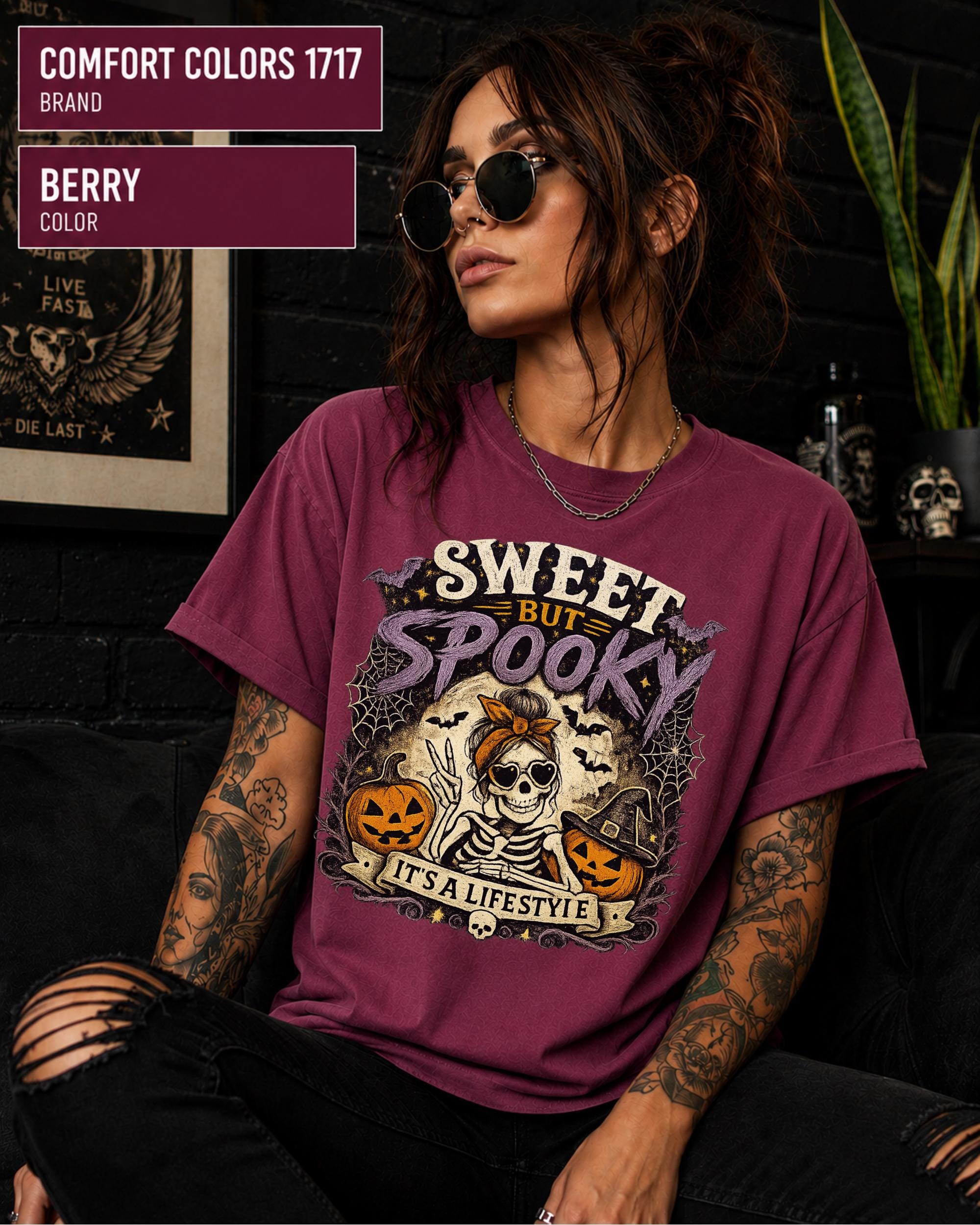 Comfort Colors Halloween tee shown in Berry with orange, purple, cream, and black details.