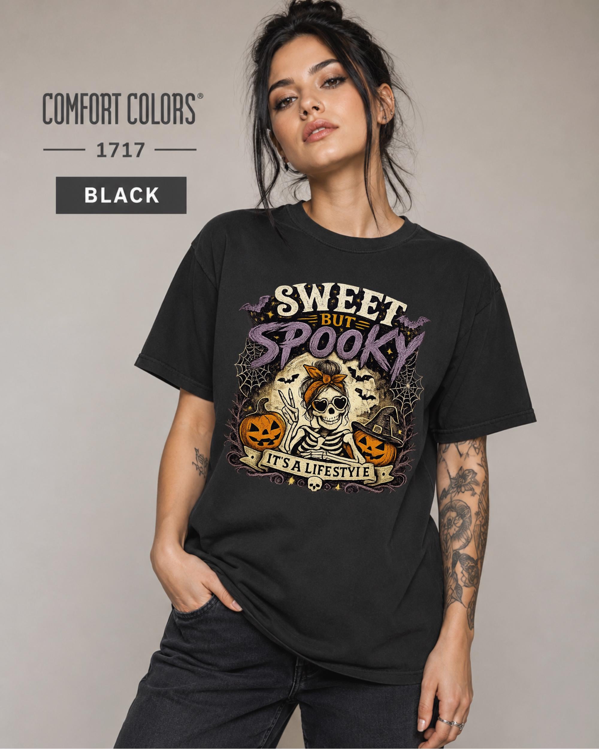 Sweet but Spooky shirt styled with black jeans in a neutral studio setting.