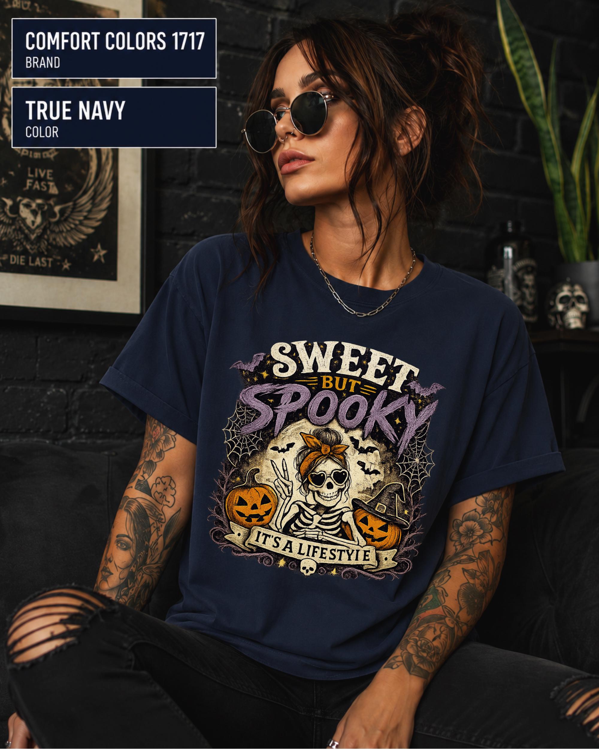 Vintage Halloween graphic tee with skeleton, sunglasses, bow, pumpkins, bats, and spiderwebs.