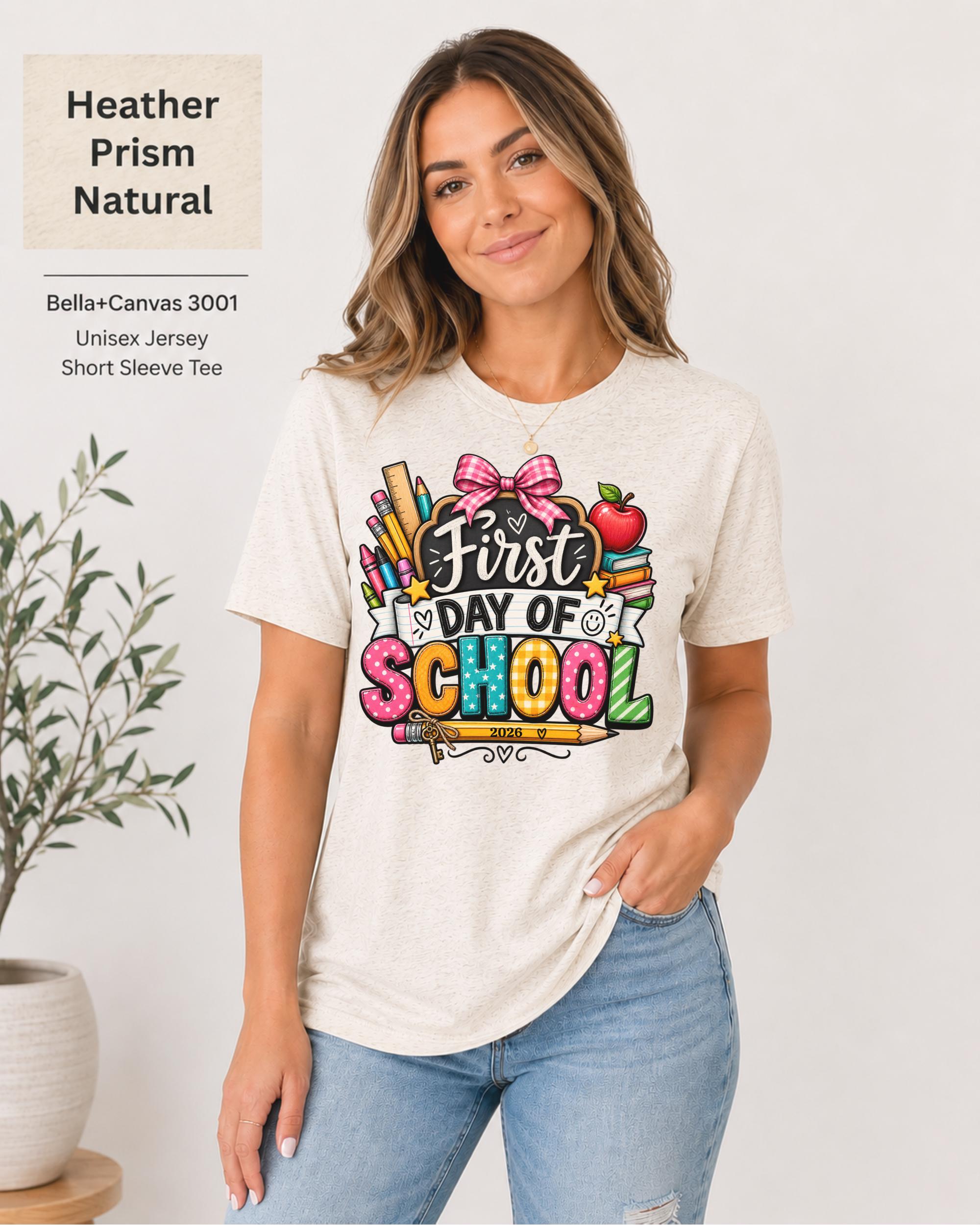 Woman wearing an Heather Prism Natural Bella+Canvas 3001 personalized First Day of School shirt with customizable teacher name and year, colorful pencils, crayons, books, apple, and pink bow design.