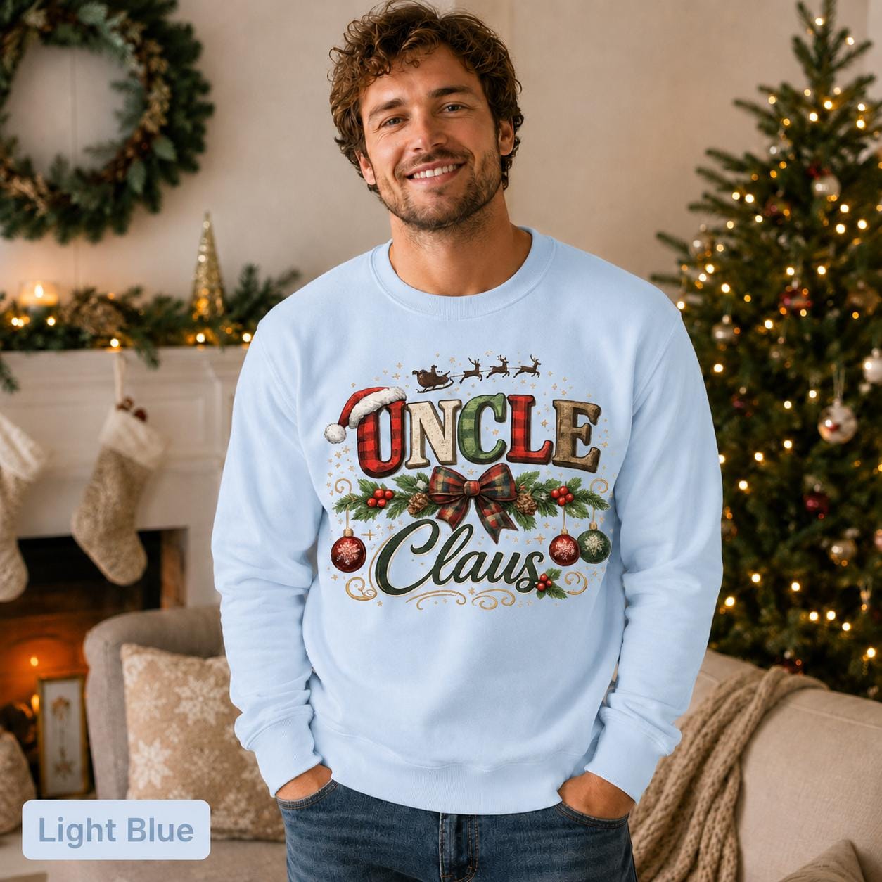Man wearing a light blue Uncle Claus Christmas sweatshirt in a cozy decorated living room.