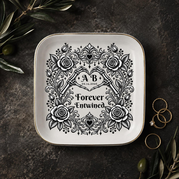Gothic jewelry dish with skeleton hands forming a heart, black roses, custom initials, date, and Forever Entwined text.