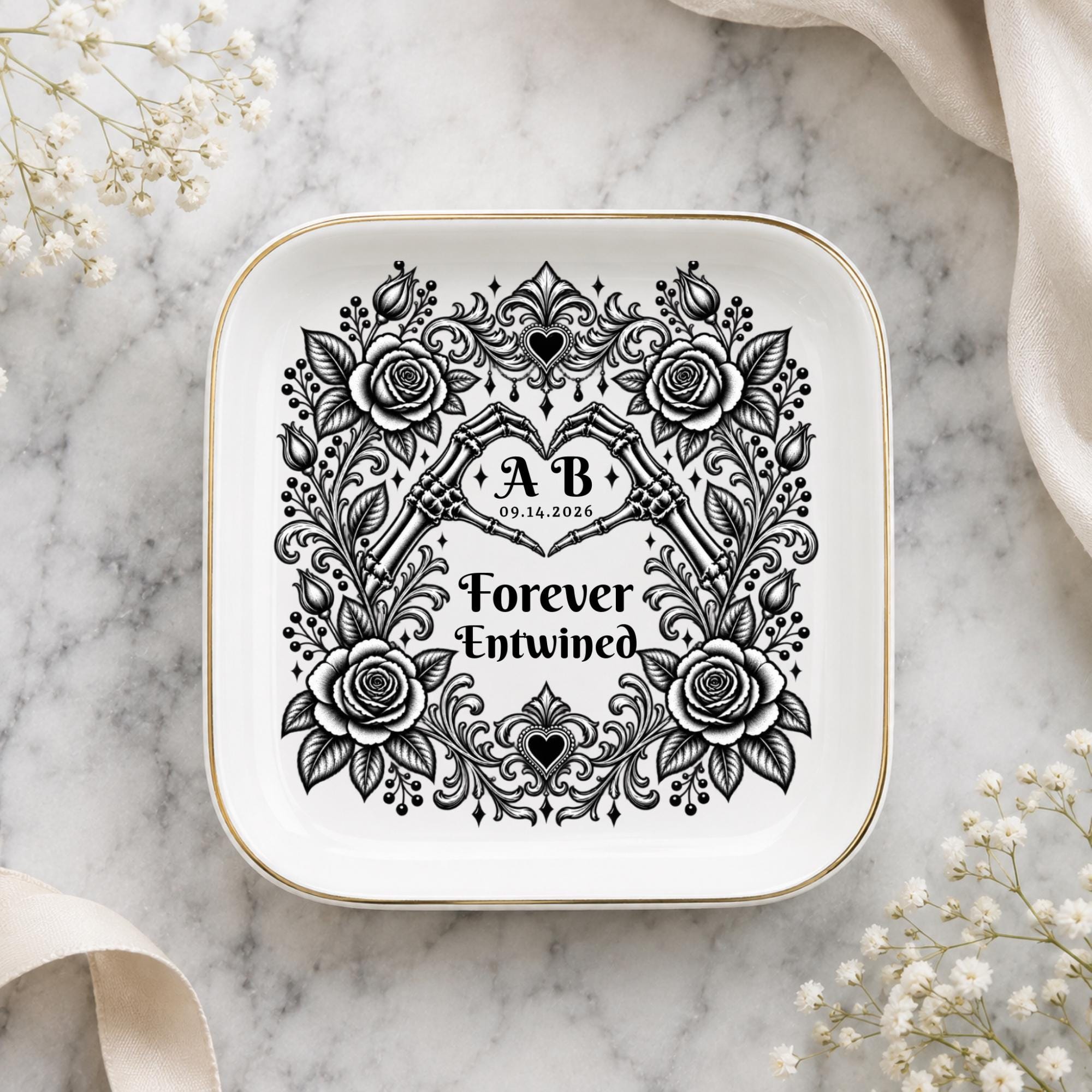 Personalized gothic ring dish featuring floral roses, ornate black scrollwork, skeleton hands, initials, and wedding date.