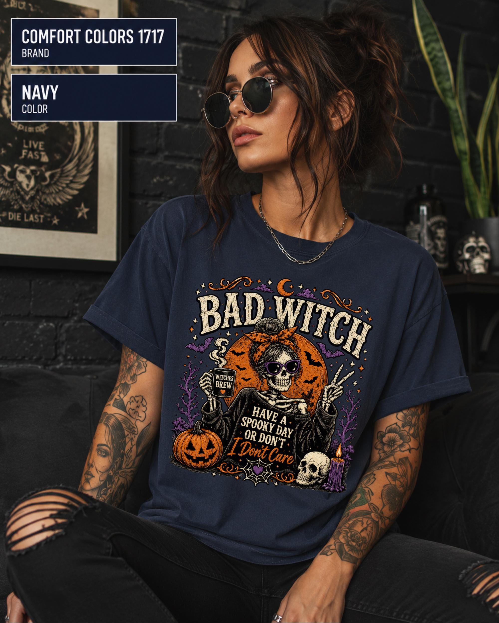 Witchy Halloween top styled with black jeans in a neutral studio setting.
