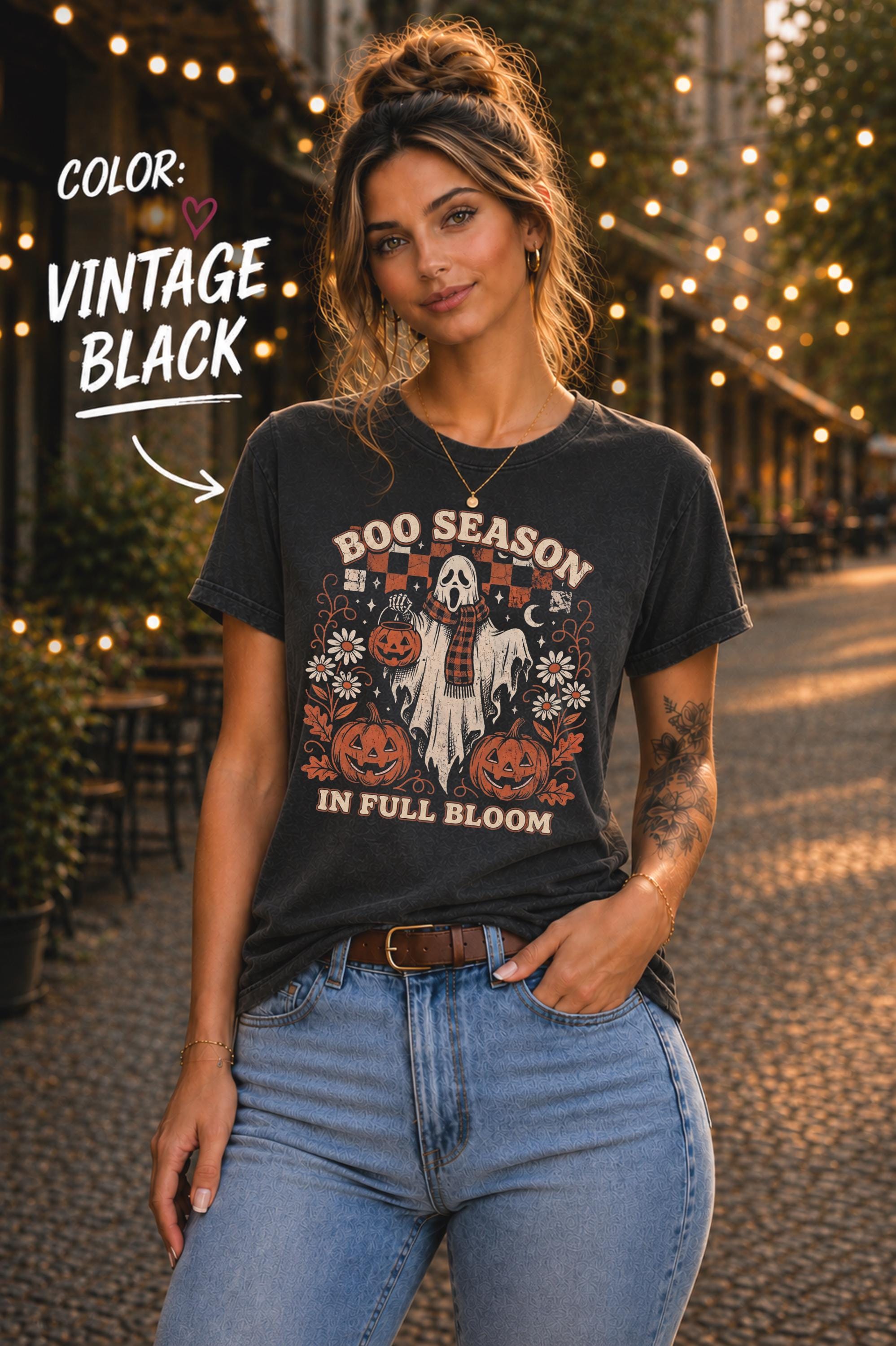 Retro spooky graphic printed on a Vintage black unisex tee with distressed orange, cream, and brown details.