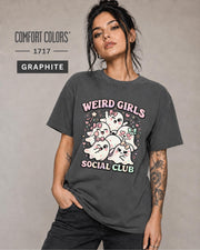 Coquette ghost tee featuring feminine bows, blush details, sparkles, and pastel accents.