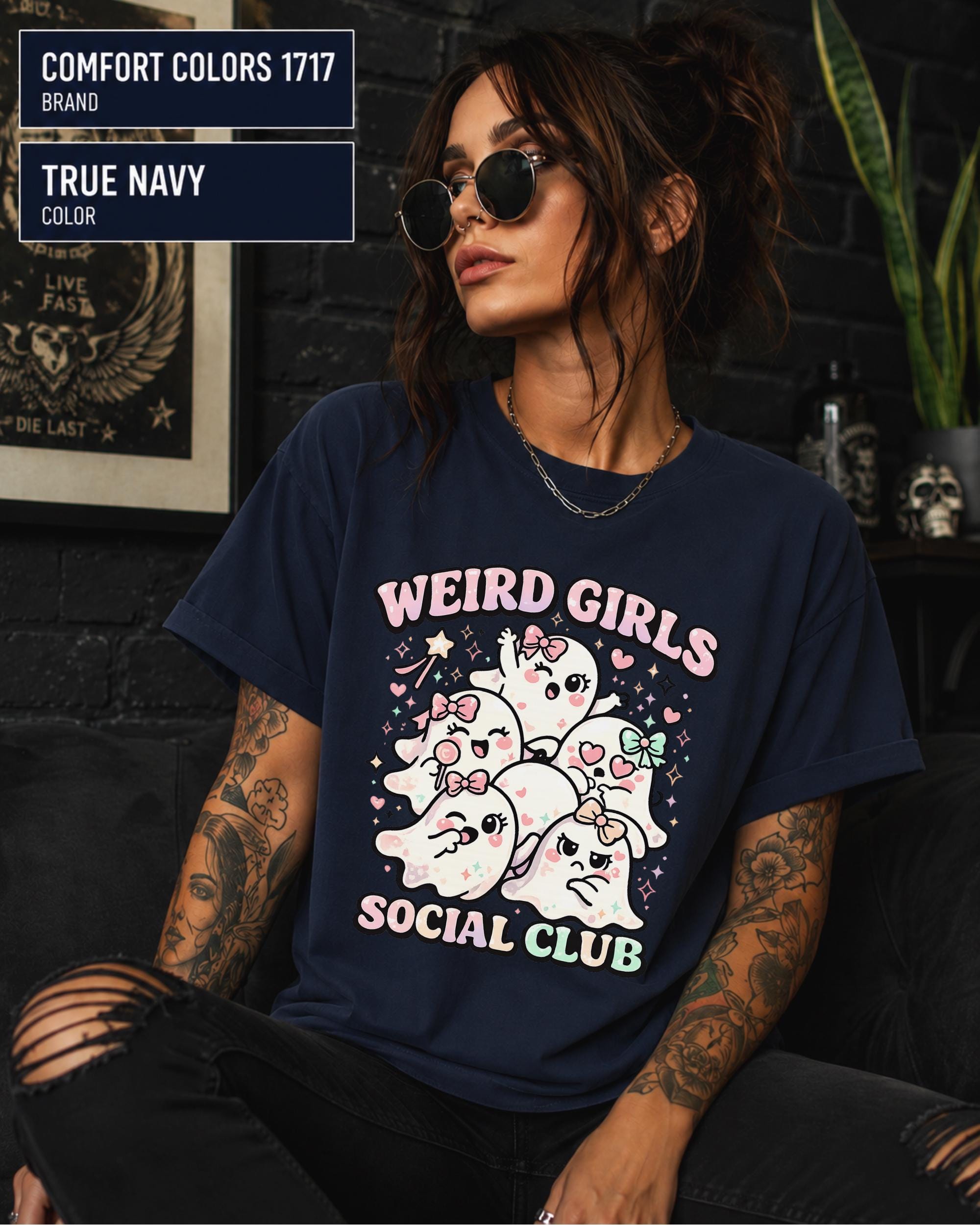 Girly Halloween shirt featuring smiling ghosts, heart patterns, ribbons, and playful expressions.