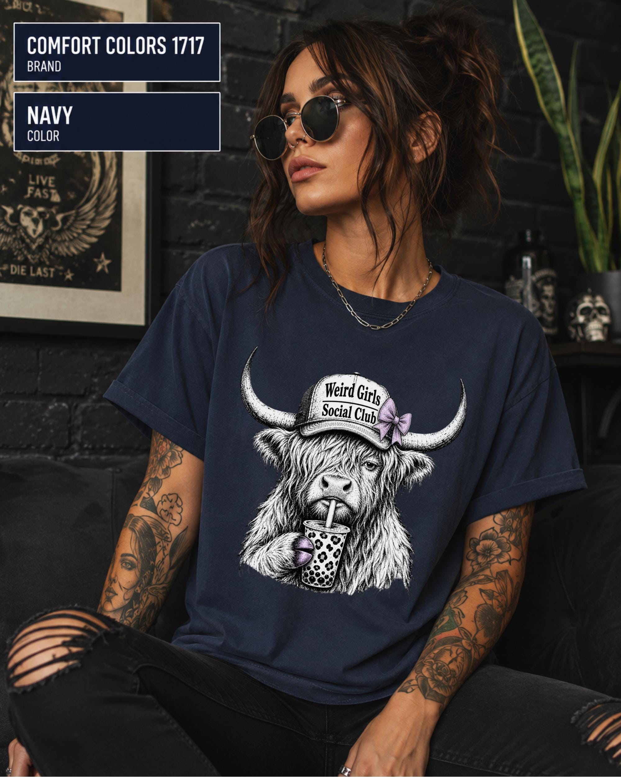 Cute western shirt showing a fluffy cow wearing a social club cap and sipping a drink through a straw.