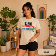 Rainbow couple shirts photographed with plants, Pride flags, and warm neutral decor.