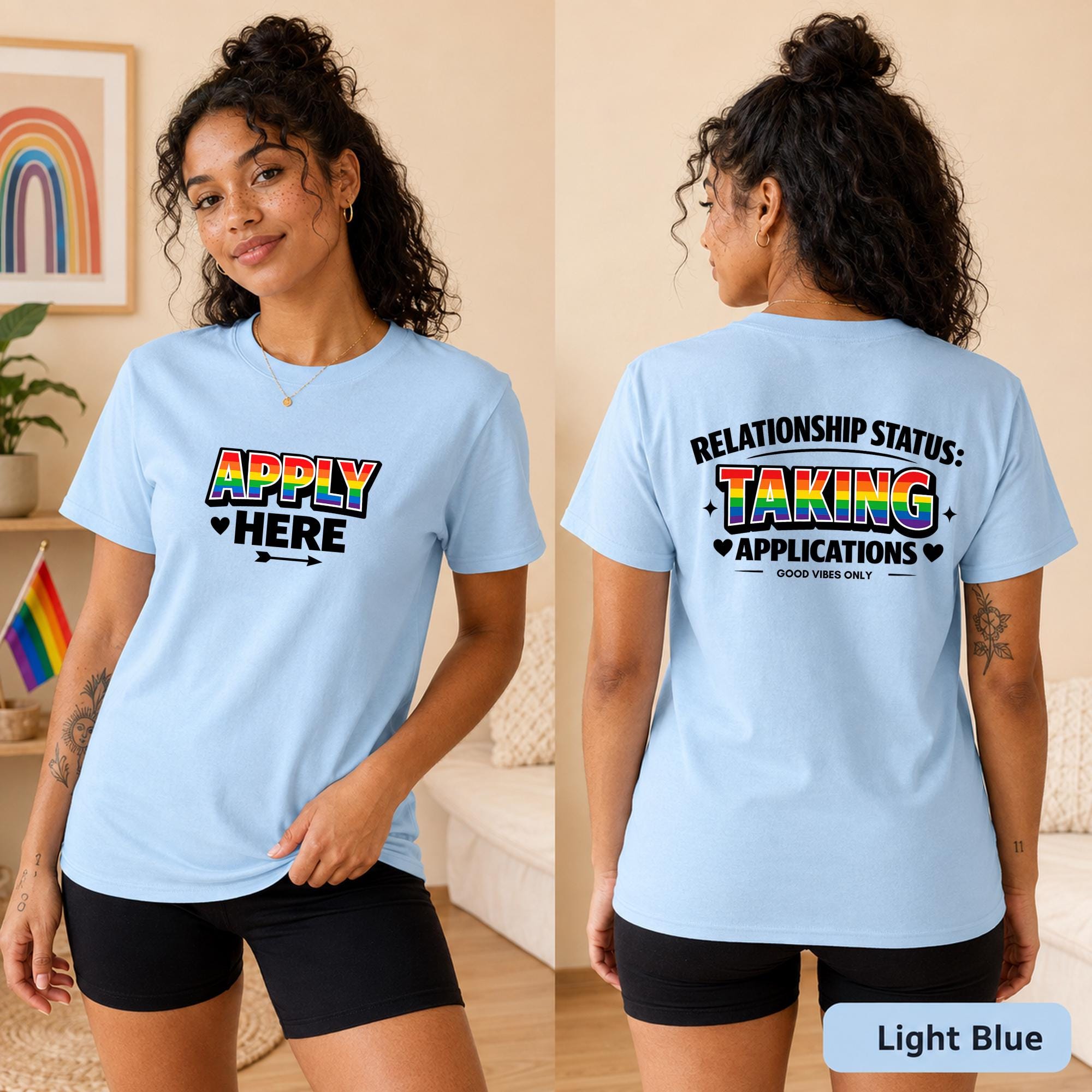 Front and back views of an light blue LGBTQ dating shirt featuring rainbow Apply Here and Taking Applications graphics.