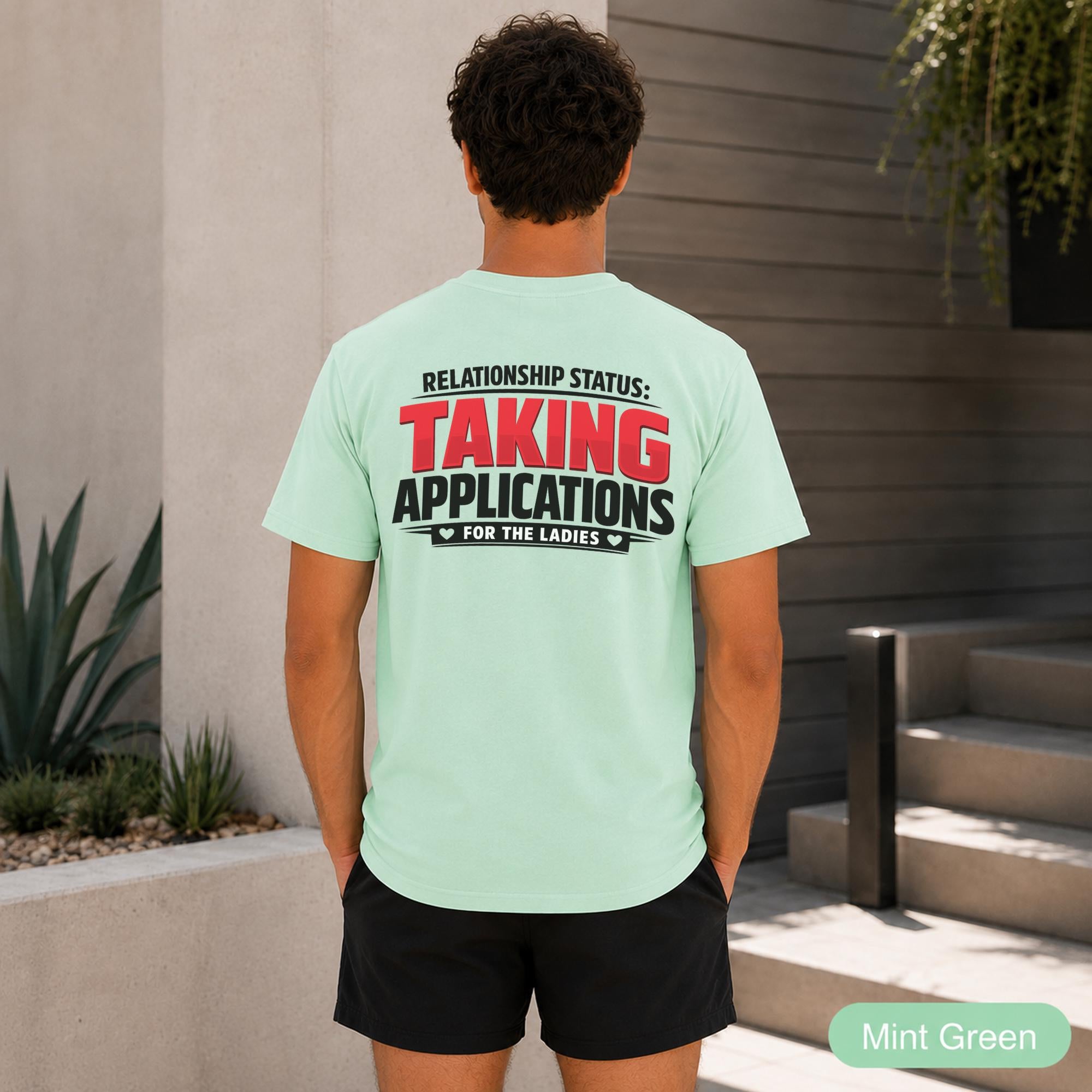 Men’s party outfit with Relationship Status lettering printed prominently across the back.