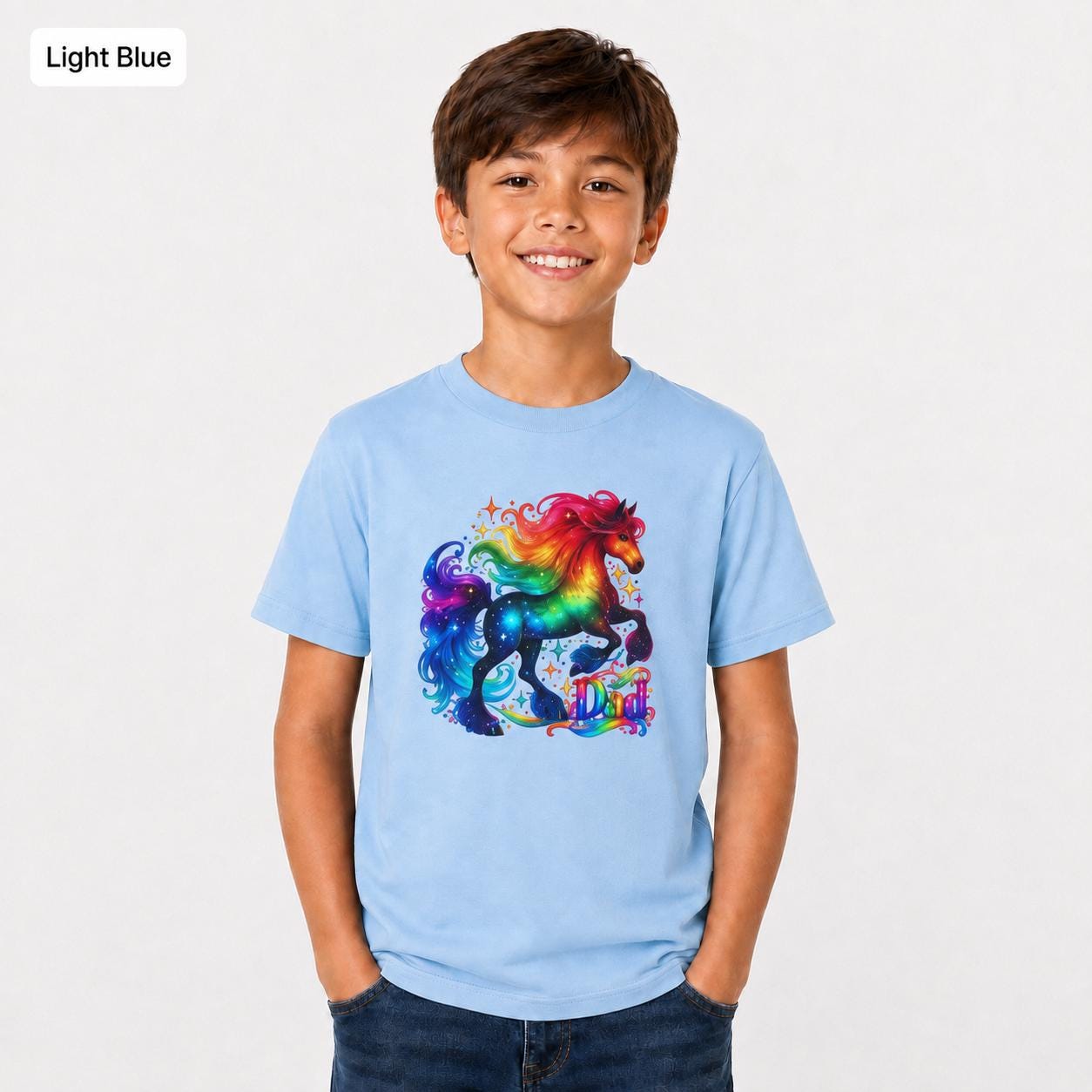 Light blue Gildan 5000B youth tee shown on a child with a bright rainbow unicorn design centered on the shirt.