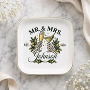 Gothic wedding ring dish featuring Mr and Mrs text, skeletal hands, green olives, cocktail glasses, and custom family name.