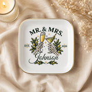 Alternative wedding keepsake dish with skeleton hands toasting, champagne, martini, olives, and custom couple details.