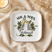 Alternative wedding keepsake dish with skeleton hands toasting, champagne, martini, olives, and custom couple details.