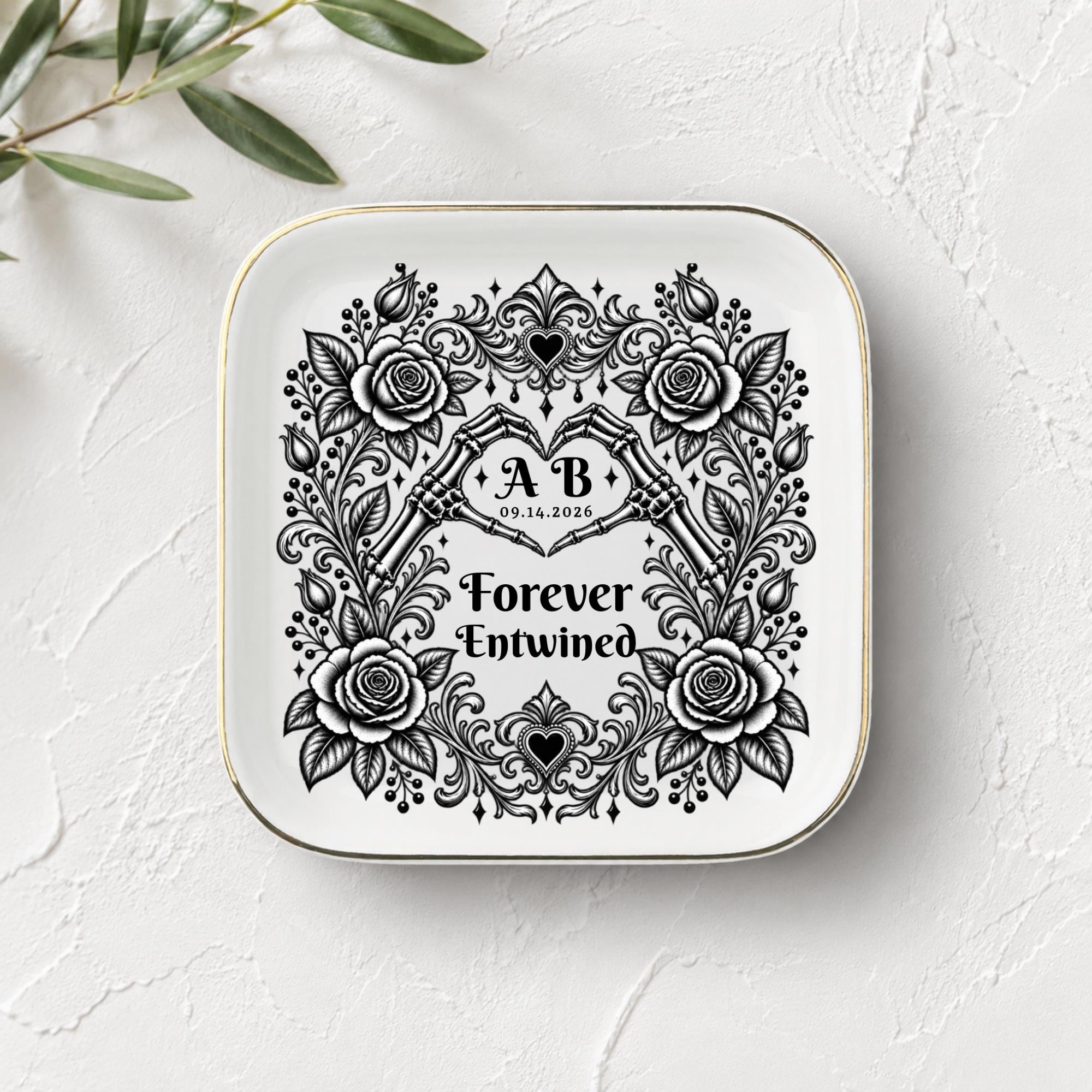White square jewelry tray with gold rim, gothic rose artwork, skeletal hands, and Forever Entwined wording.