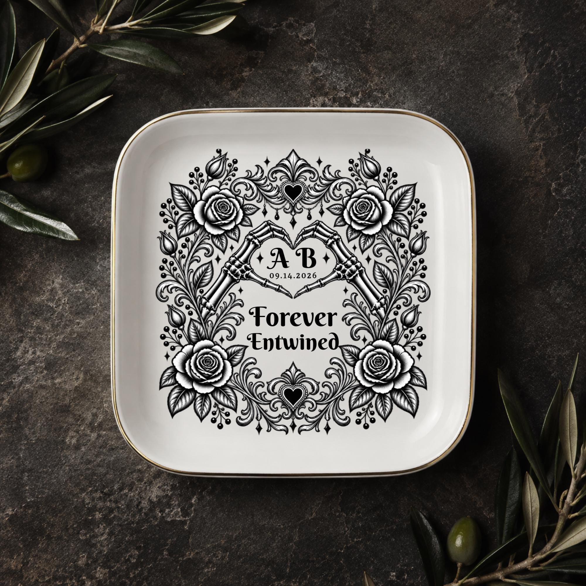 Dark romance jewelry dish with skeleton hand heart, floral frame, custom initials, and Forever Entwined message.