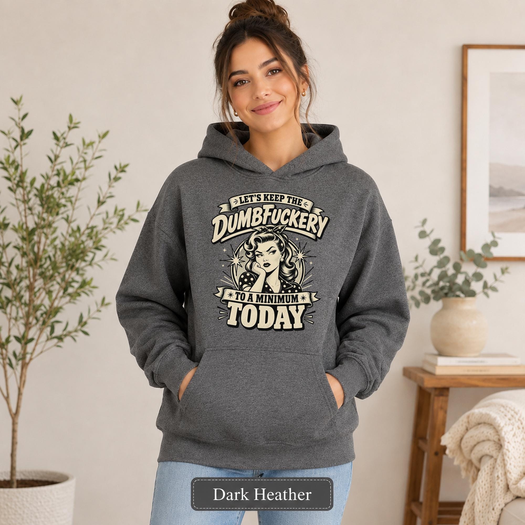 Woman wearing a dark heather Gildan 18500 hoodie with blank front, kangaroo pocket, relaxed unisex fit, and dark heather color label.