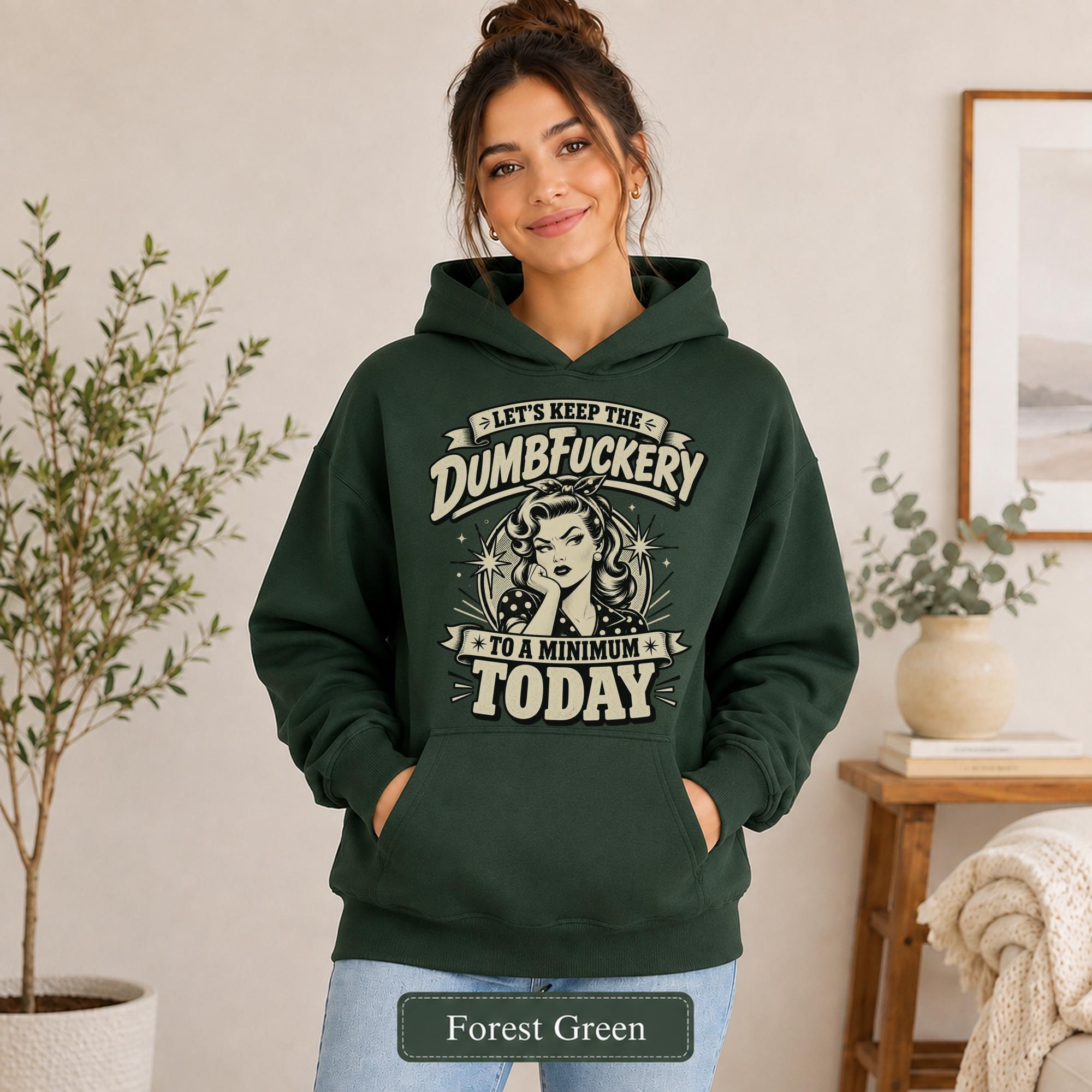 Woman wearing a forest green Gildan 18500 hoodie with blank printable chest area, front pocket, and forest green color label.