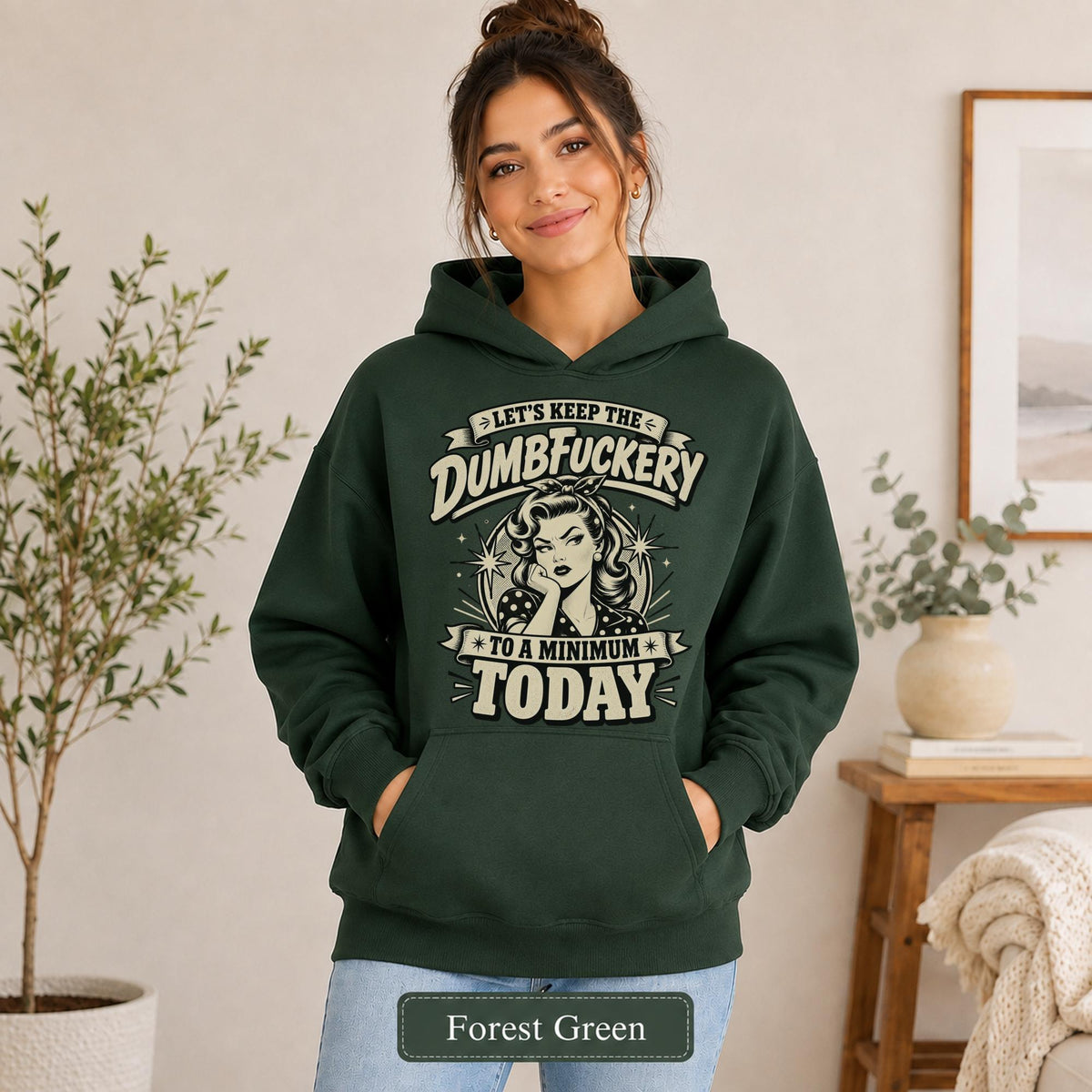 Woman wearing a forest green Gildan 18500 hoodie with blank printable chest area, front pocket, and forest green color label.