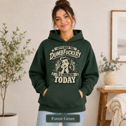 Woman wearing a forest green Gildan 18500 hoodie with blank printable chest area, front pocket, and forest green color label.